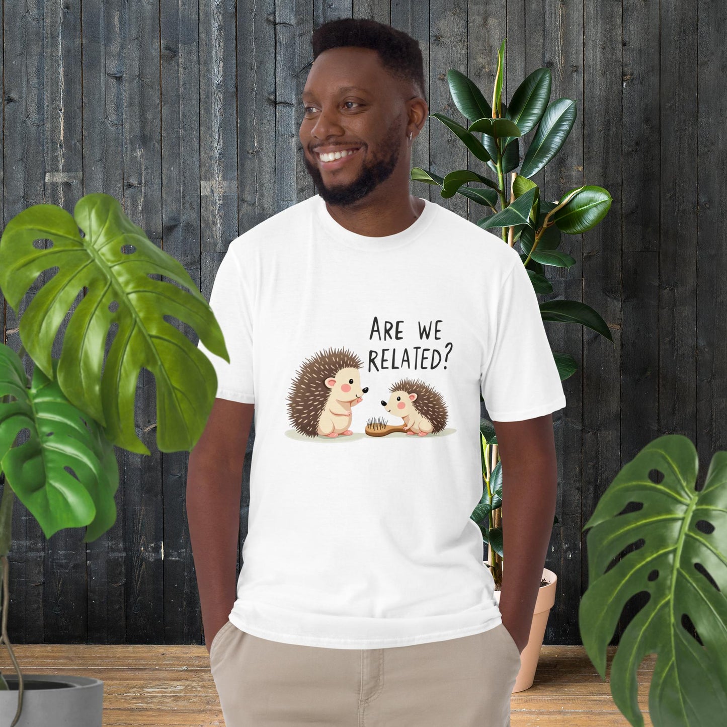 Man wearing funny hedgehog graphic tee with 'Are We Related?' text, cute animal duo design, unisex cotton t-shirt