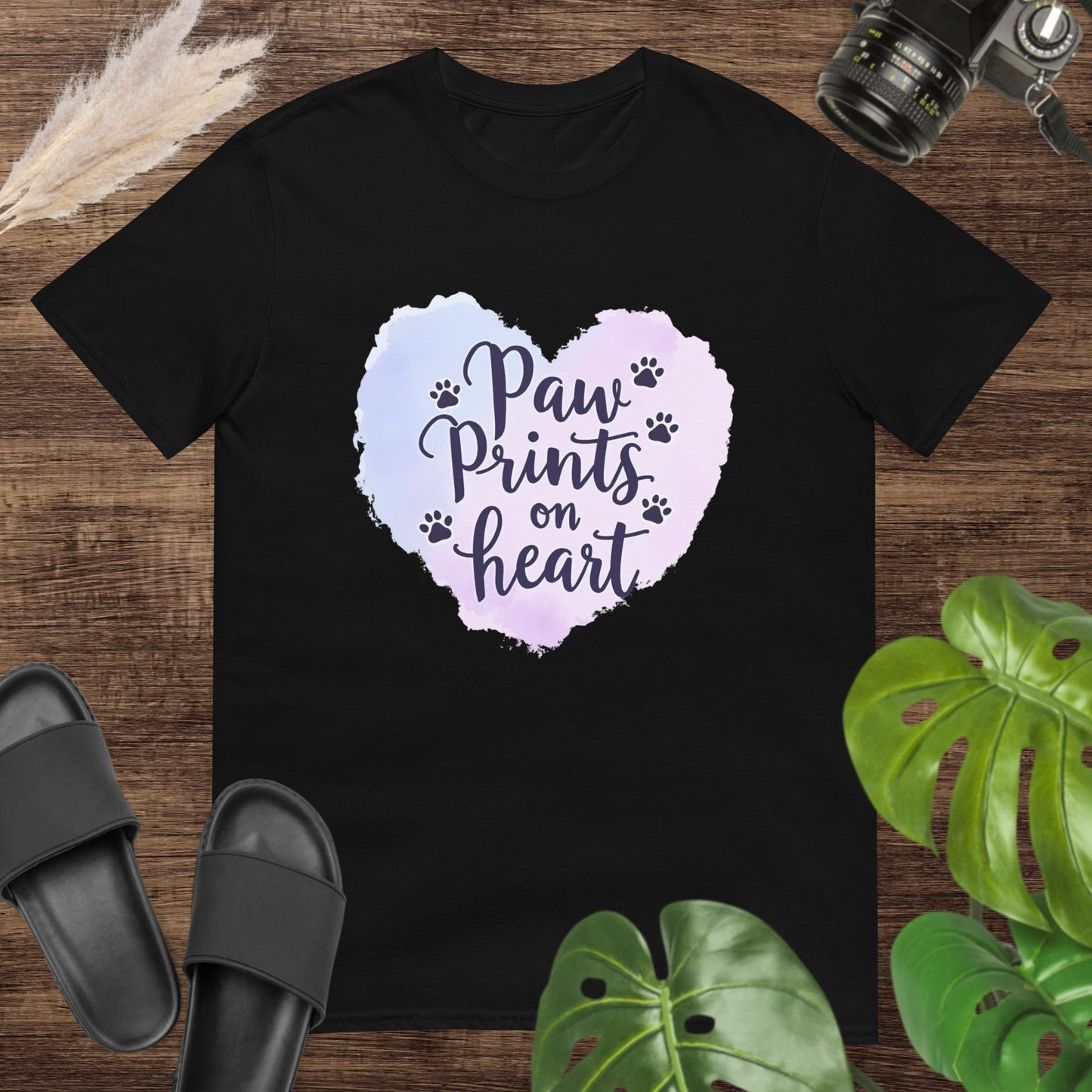 Black t-shirt featuring a watercolor heart and paw prints around the text "Paw Prints on Heart"