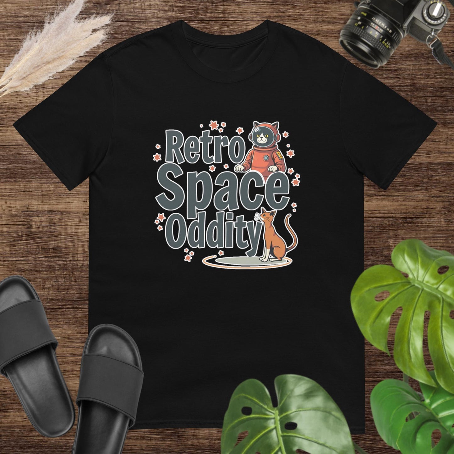 Black t-shirt featuring a retro space cat & cosmic animal graphics and text "Retro space oddity".