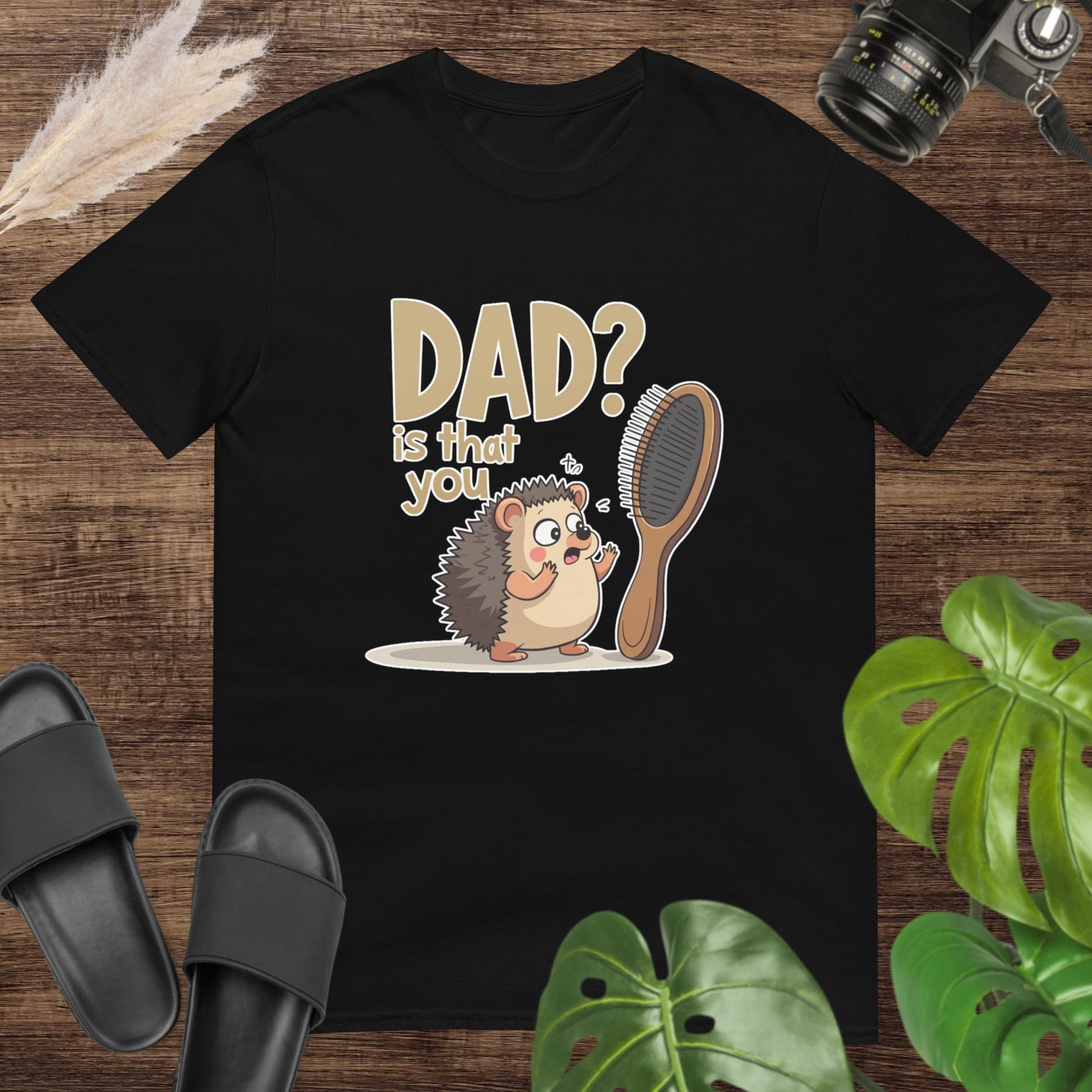 Cute black t-shirt featuring a cartoon hedgehog beside a hairbrush and text "Dad? is that you"