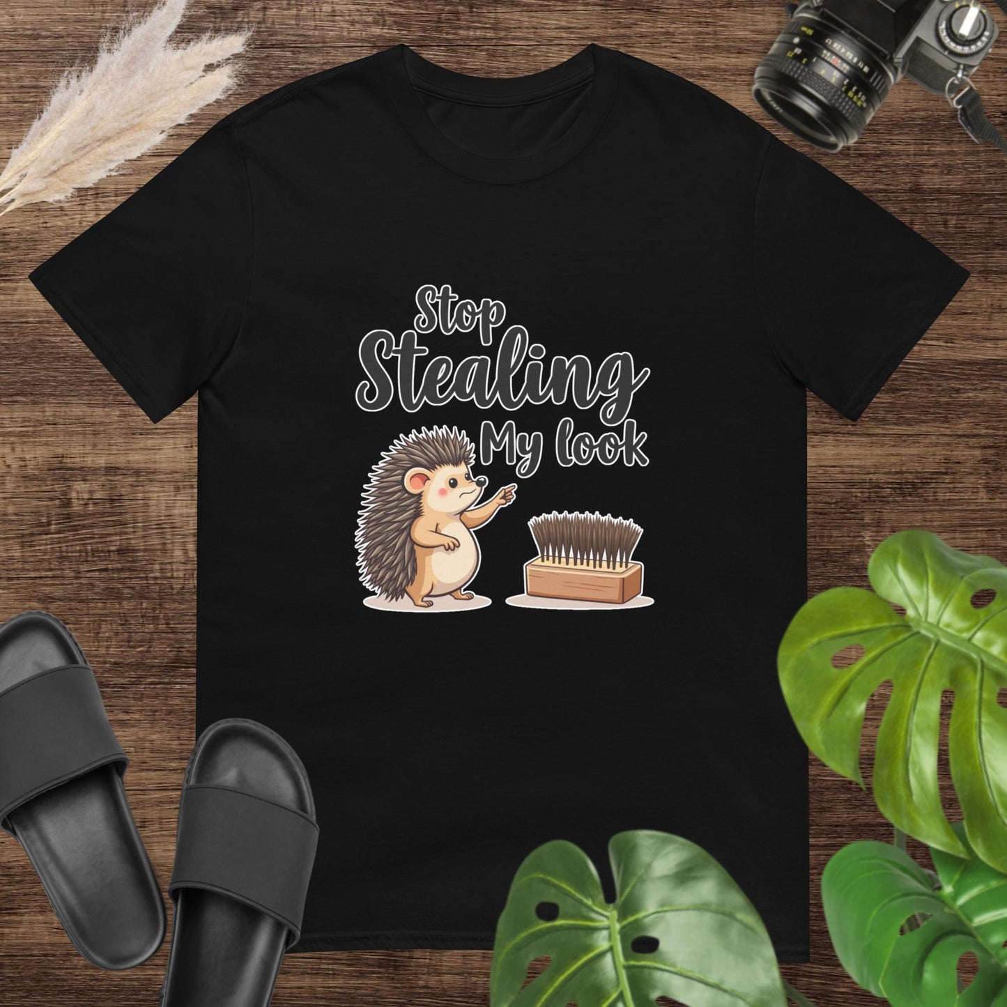 Black t-shirt featuring a hedgehog pointing at a hairbrush with the text "Stop stealing my look"