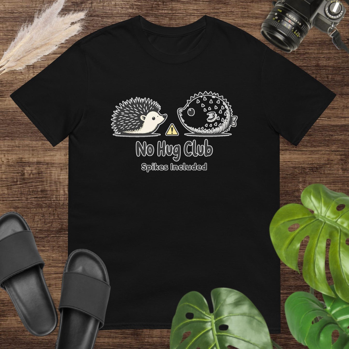 Unisex black t-shirt featuring a hedgehog and pufferfish shirt with a no-hug message.