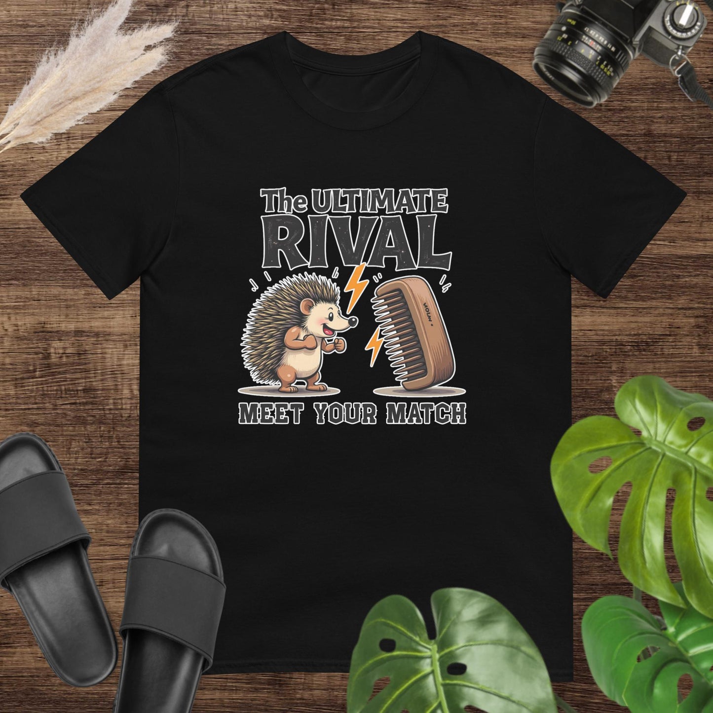 Quirky hedgehog black t-shirt with a hairbrush rivalry and text "The ultimate rival. Meet yout match"