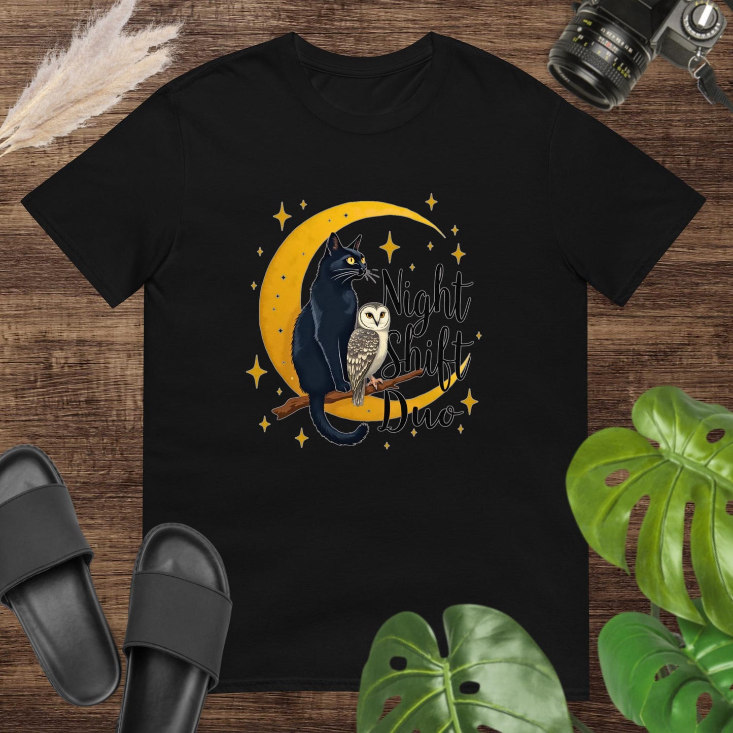 Cute black t-shirt featuring a cat and owl on a moon and branch with the text "Night Shitf Duo"