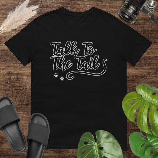 Funny black t-shirt featuring a tail and 2 little paws after the text Talk to the Tail
