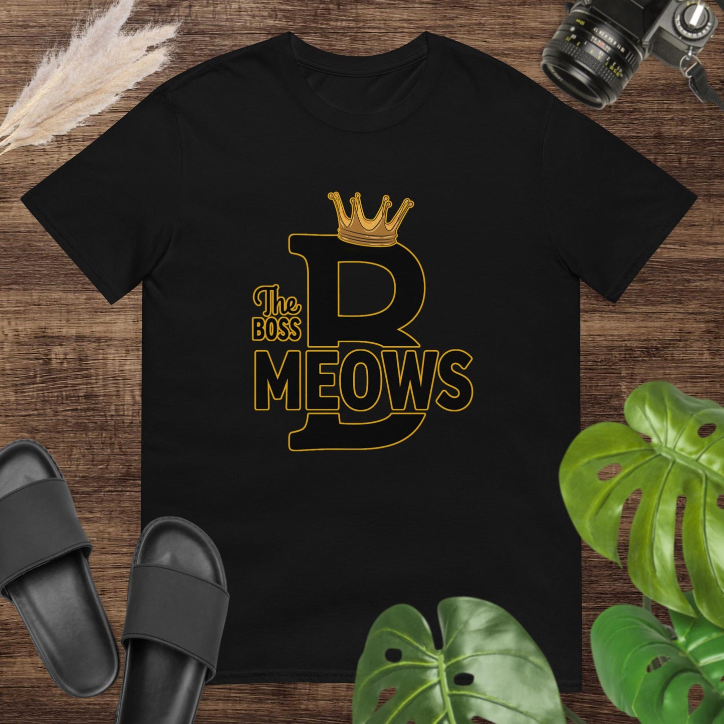 Funny tyography black t-shirt featuring a crown on one big B letter and text The boss Meows