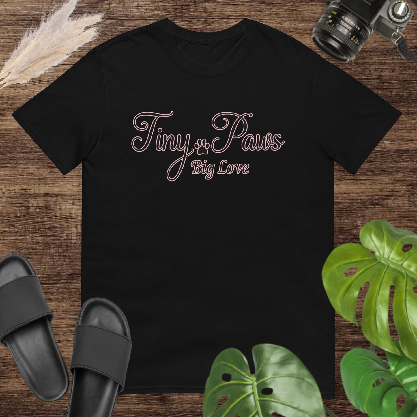 Cute black t-shirt featuring a tiny paw print with text Tiny Paws Big Love