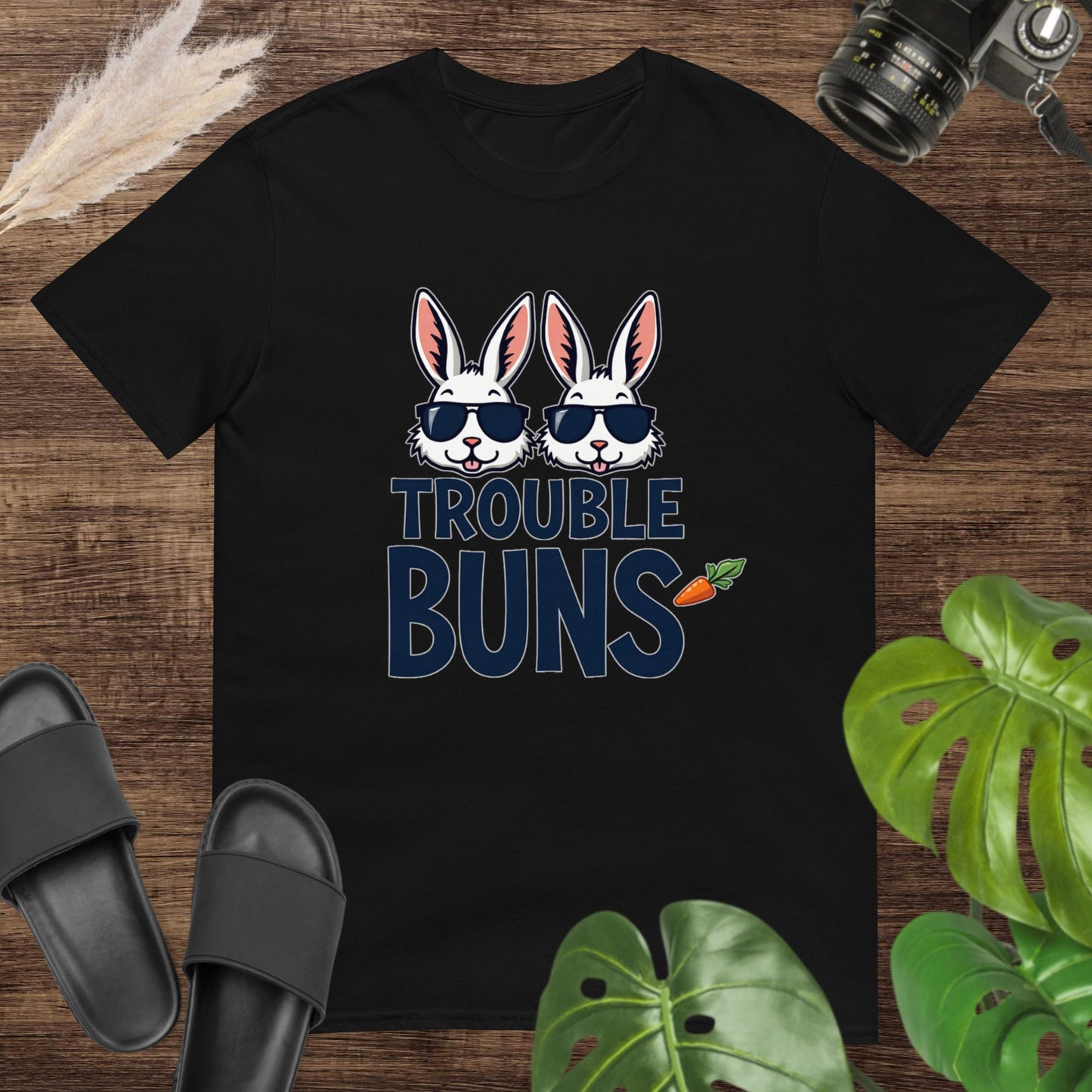 Funny black t-shirt featuring two bunny heads with glasses and the text trouble buns
