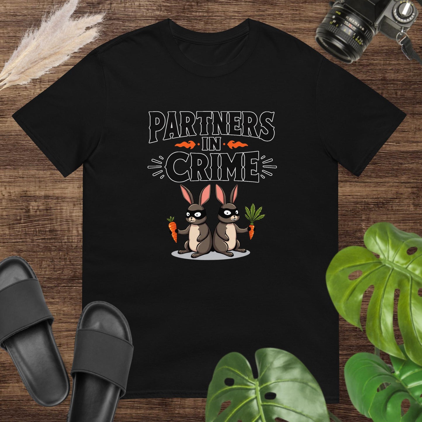 Funny partners in crime black t-shirt design with 2 masked rabbits holding carrots