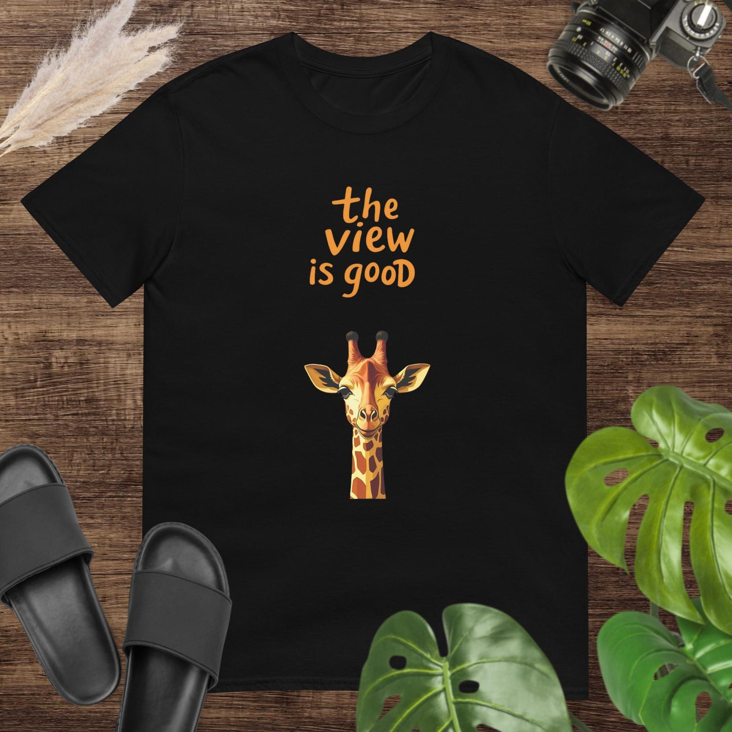 Funny giraffe head design black t-shirt with the text "The View Is Good"