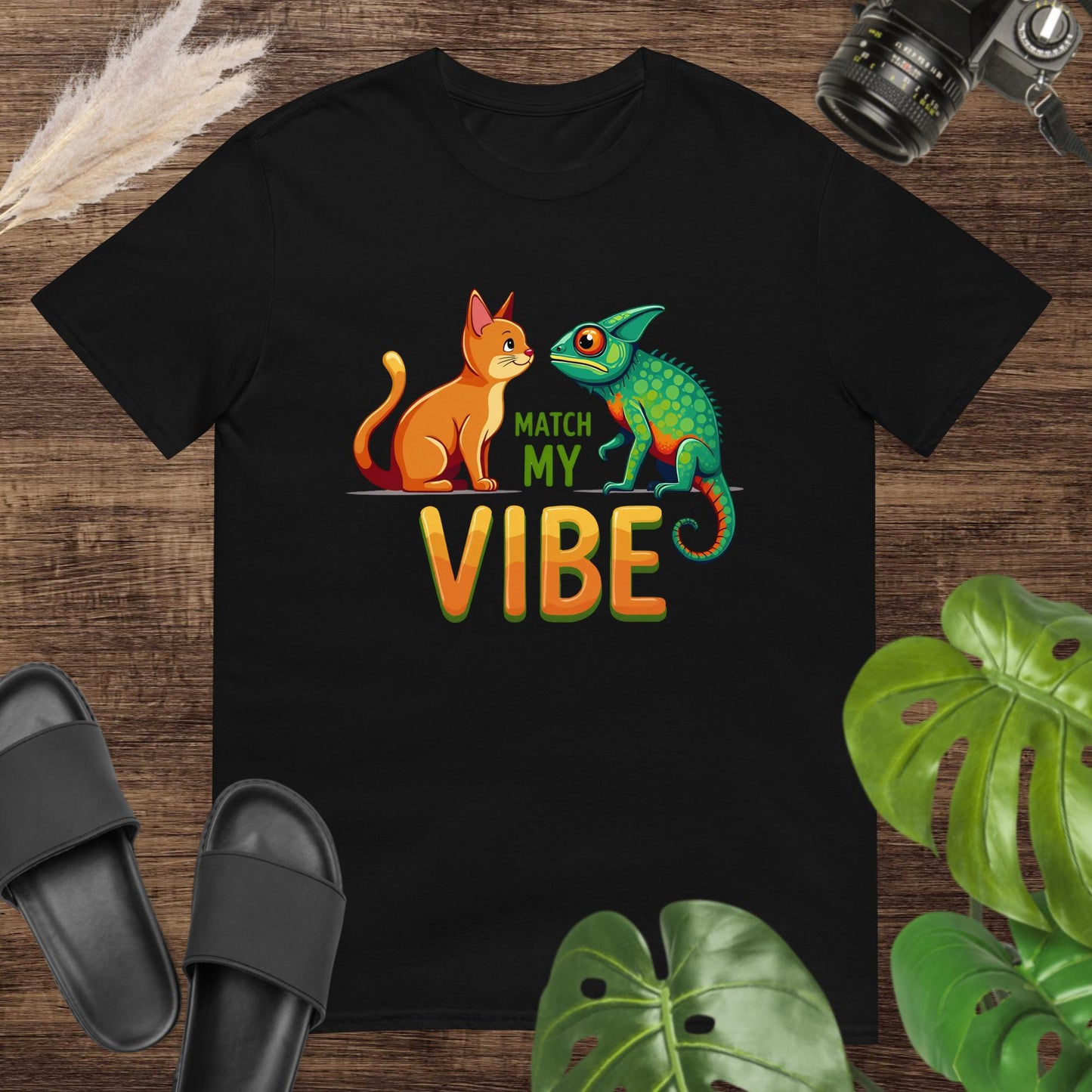 Unisex black t-shirt featuring a cat and chameleon with the text Match My Vibe.