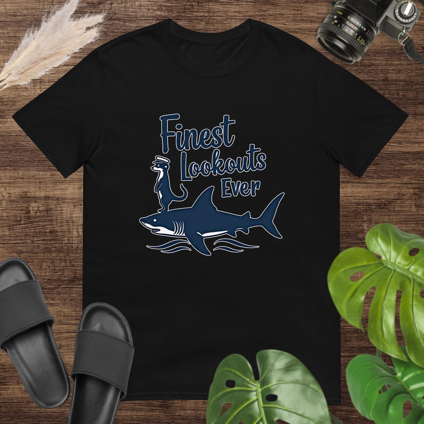 Unisex black t-shirt featuring a shark with a meerkat and the text Finest Lookouts Ever.