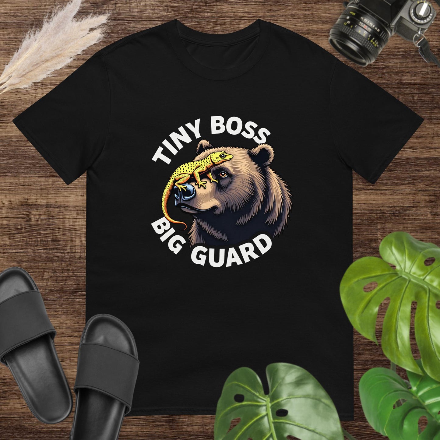 Unisex black tee featuring a bear and gecko graphic with Tiny Boss, Big Guard text.