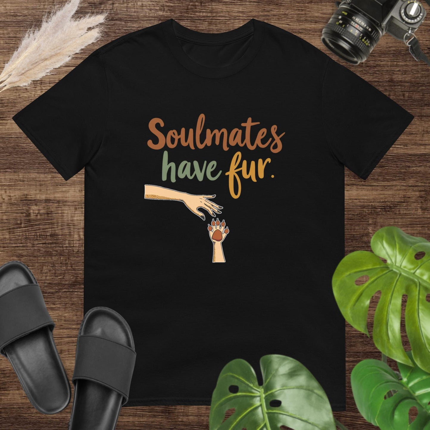 Black t-shirt with text "Soulmates have fur" with a hand reaching a paw