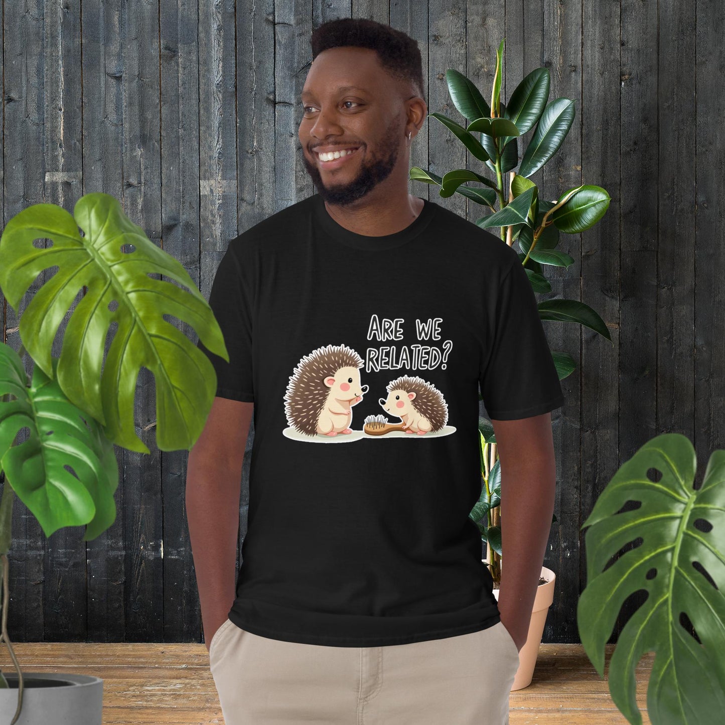 Man wearing funny hedgehog graphic tee with 'Are We Related?' text, cute animal duo design, unisex cotton t-shirt