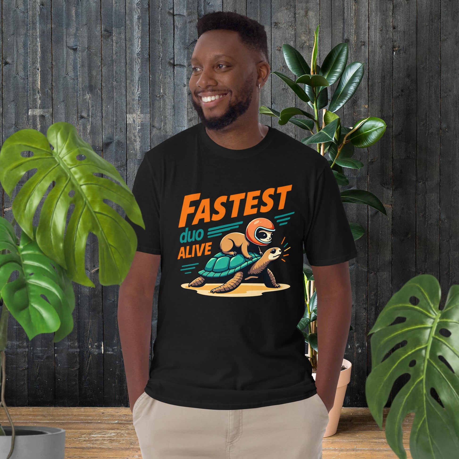 Funny unisex tee with sloth riding turtle, 'Fastest Duo Alive' graphic, perfect gift for pet lovers