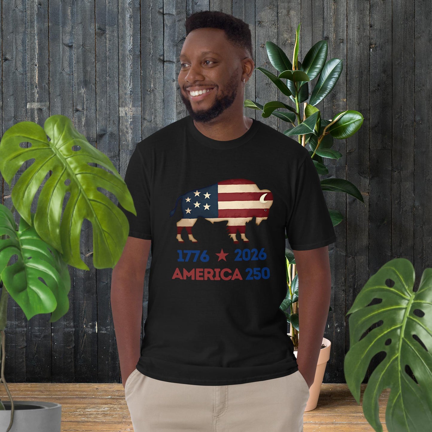 Man wearing black t-shirt with American flag bison graphic, '1776 2026 America 250' text, unisex patriotic tee