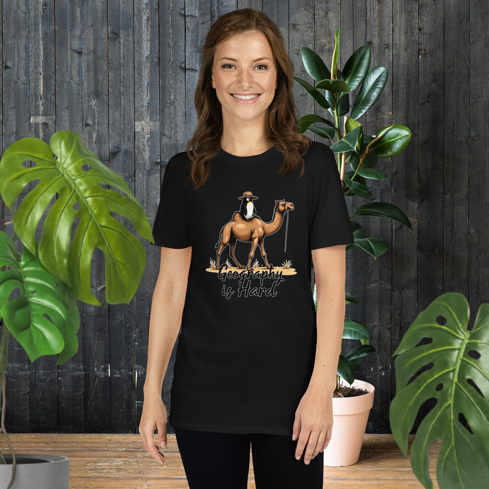 Funny penguin on camel graphic tee, 'Geography is Hard' text, 100% ring-spun cotton unisex t-shirt
