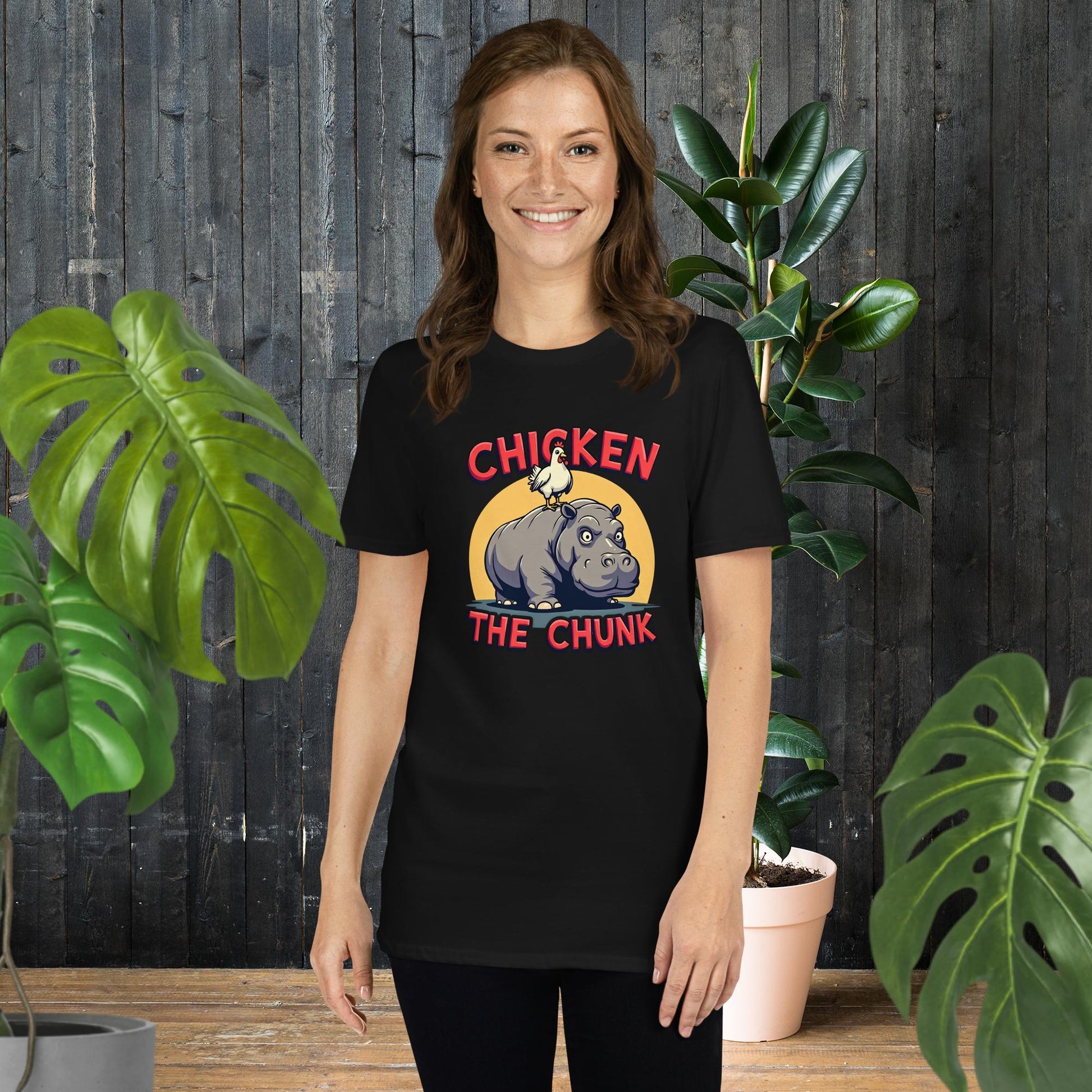 Woman wearing funny unisex t-shirt with chicken on hippo graphic, 100% ring-spun cotton, perfect gift for pet lovers