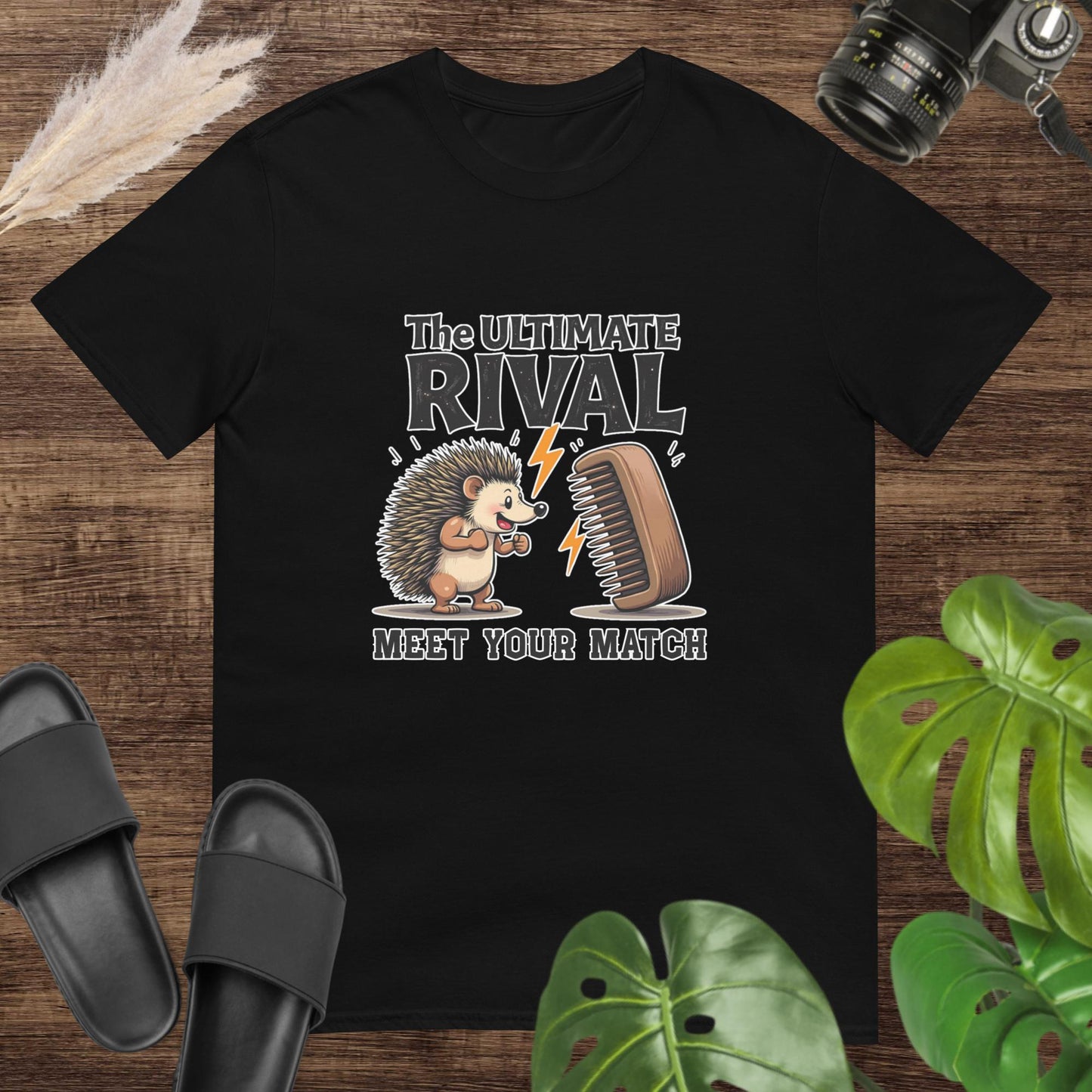 Quirky hedgehog black t-shirt with a hairbrush rivalry and text "The ultimate rival. Meet yout match"