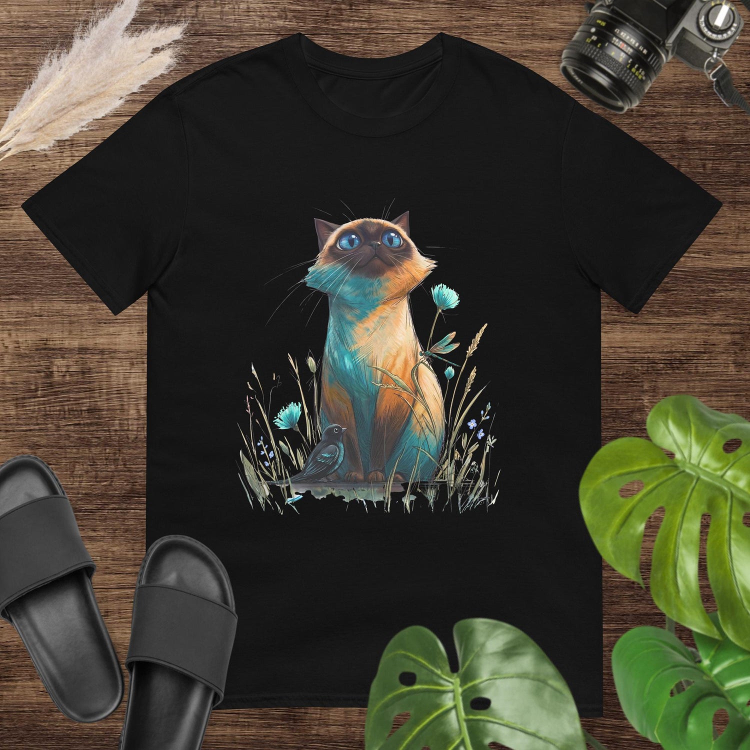 Unisex t-shirt featuring a colorful hand-drawn cat looking up at a small bird.