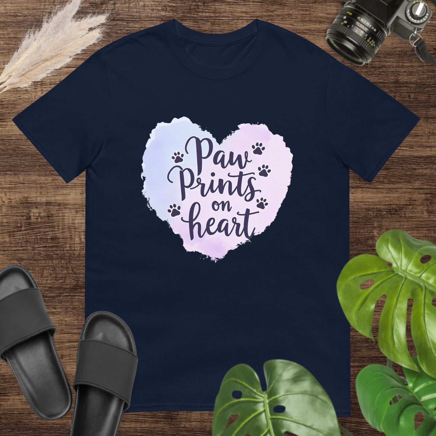 Navy t-shirt featuring a watercolor heart and paw prints around the text "Paw Prints on Heart"