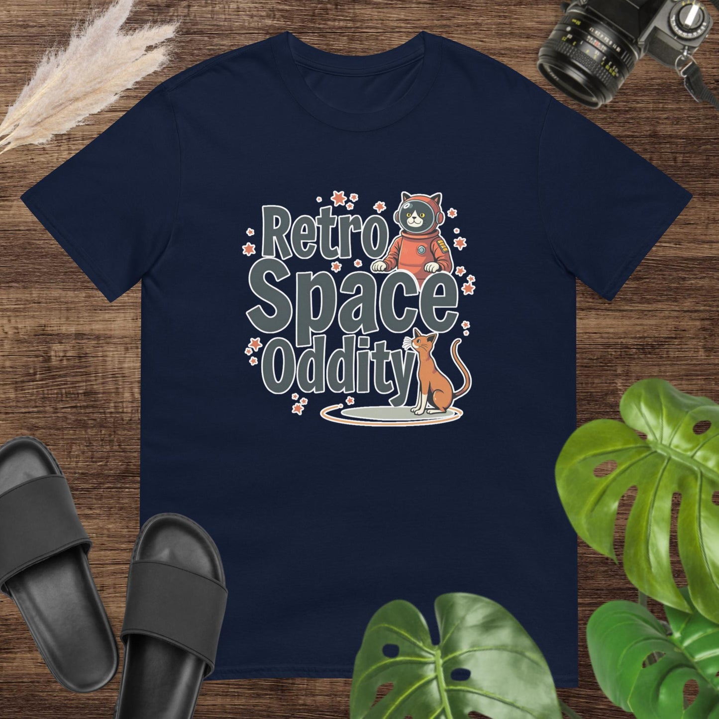 Navy t-shirt featuring a retro space cat & cosmic animal graphics and text "Retro space oddity".