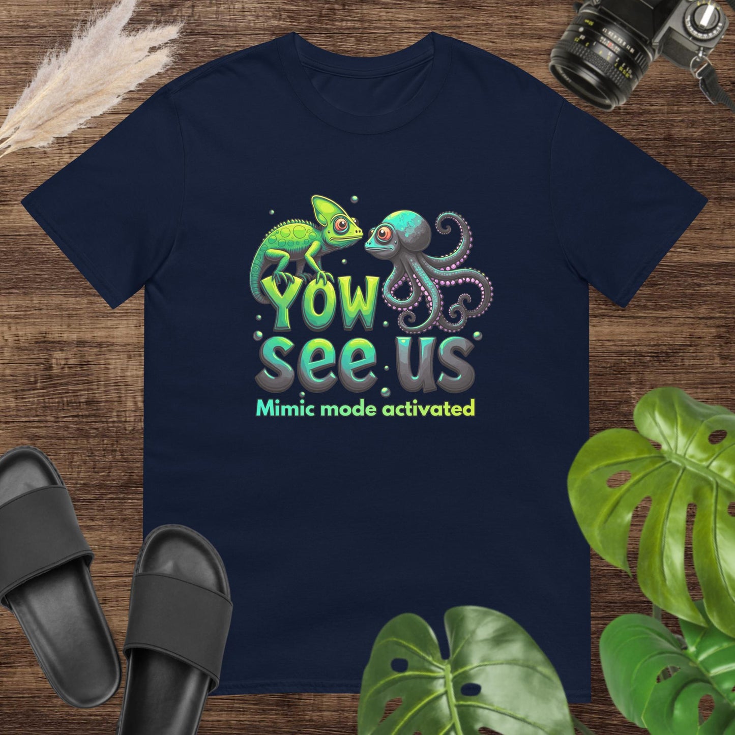 Navy t-shirt featurung a chameleon and an octopus shirt with the text "Yow see us. Mimic mode activated"