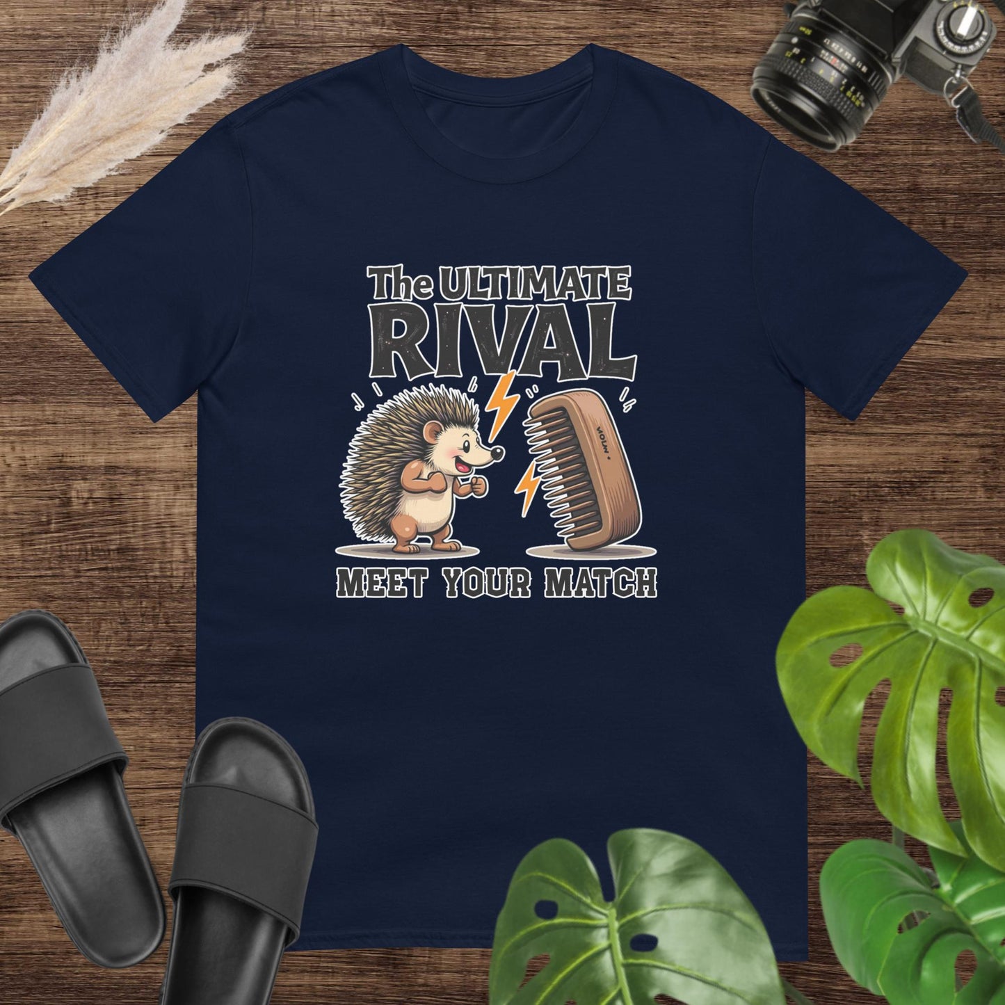 Quirky hedgehog navy t-shirt with a hairbrush rivalry and text "The ultimate rival. Meet yout match"