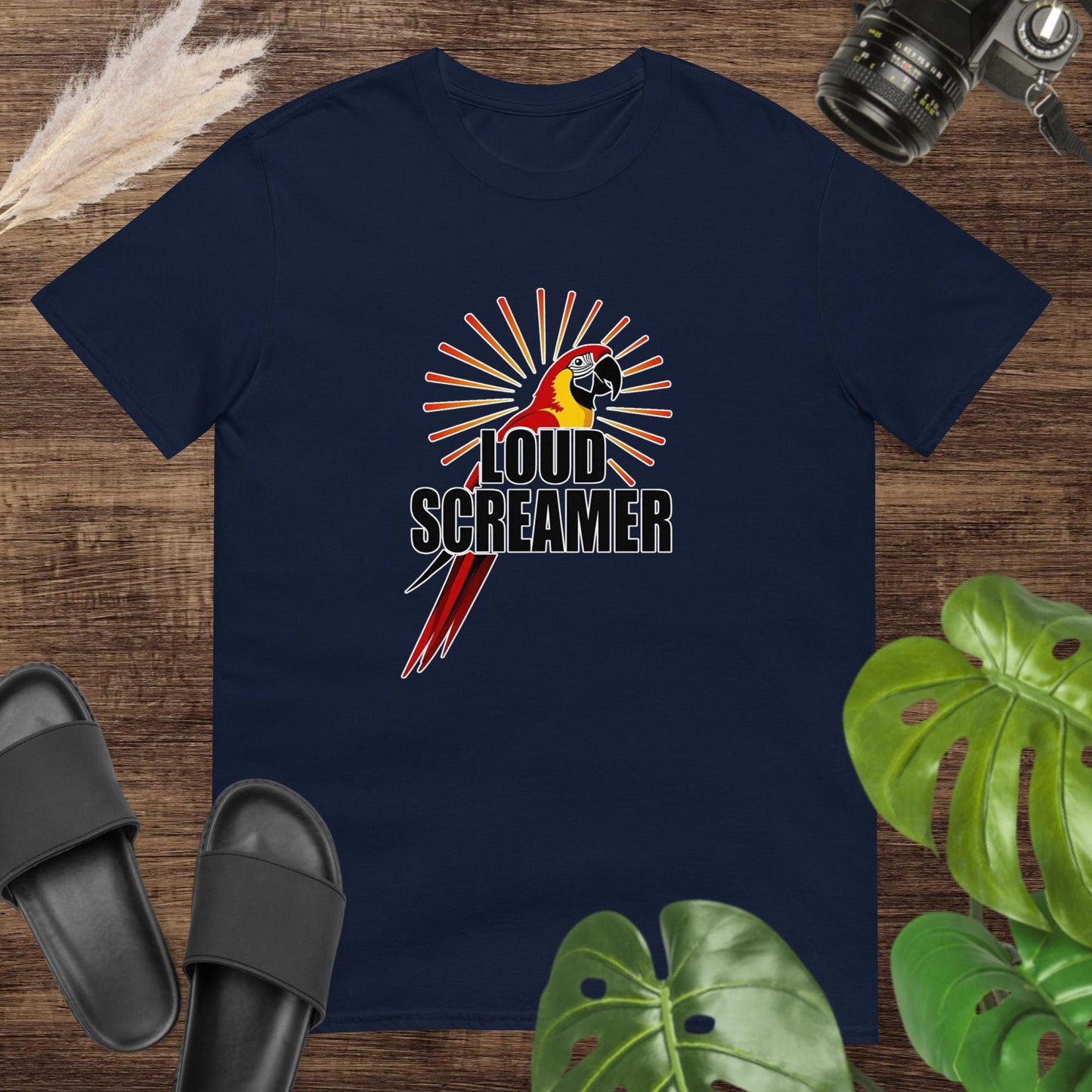 Navy t-shirt featuring a colorful parrot with the words “LOUD SCREAMER” and sunburst lines.