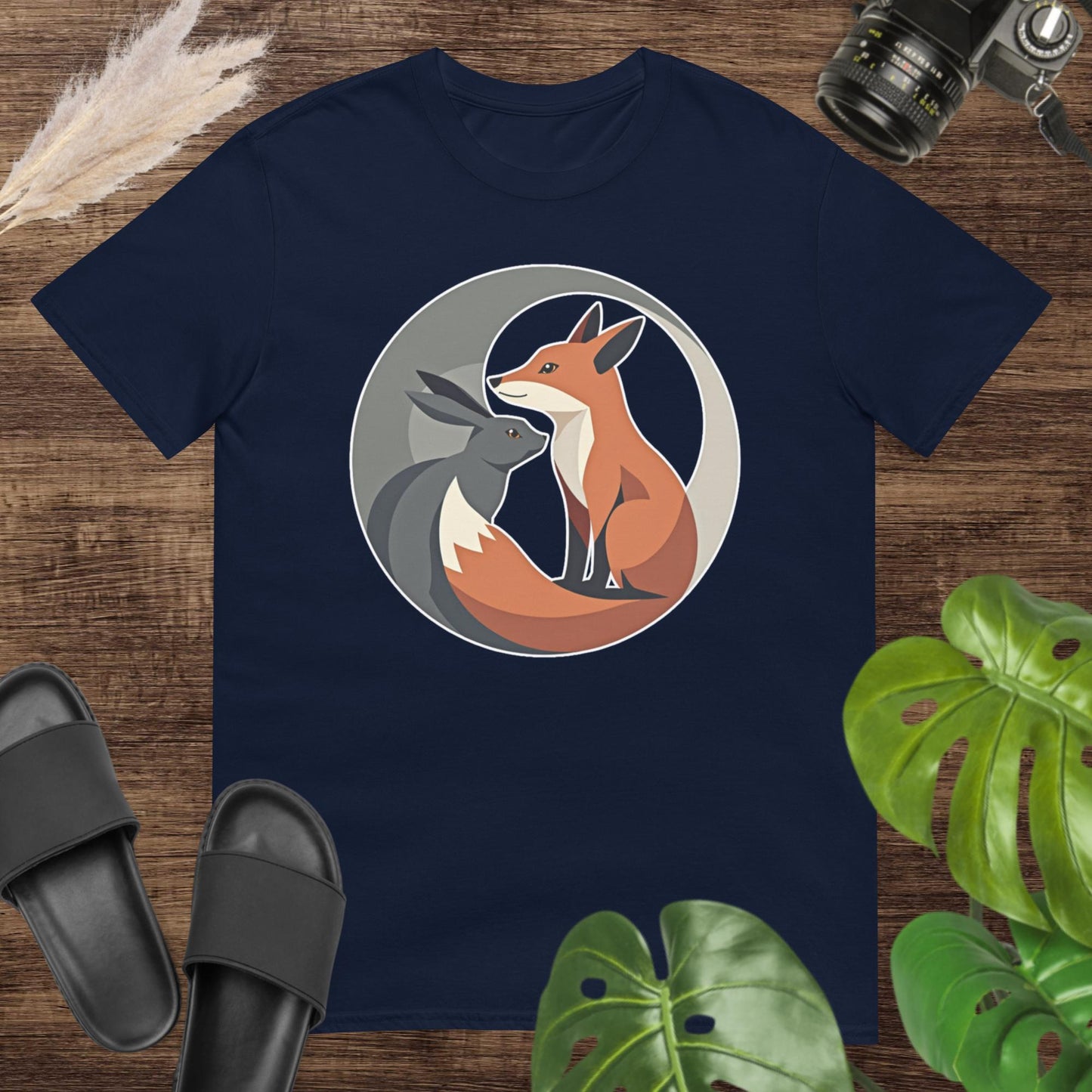 Elegant navy t-shirt featuring a fox and hare with a clean and balanced circular style.