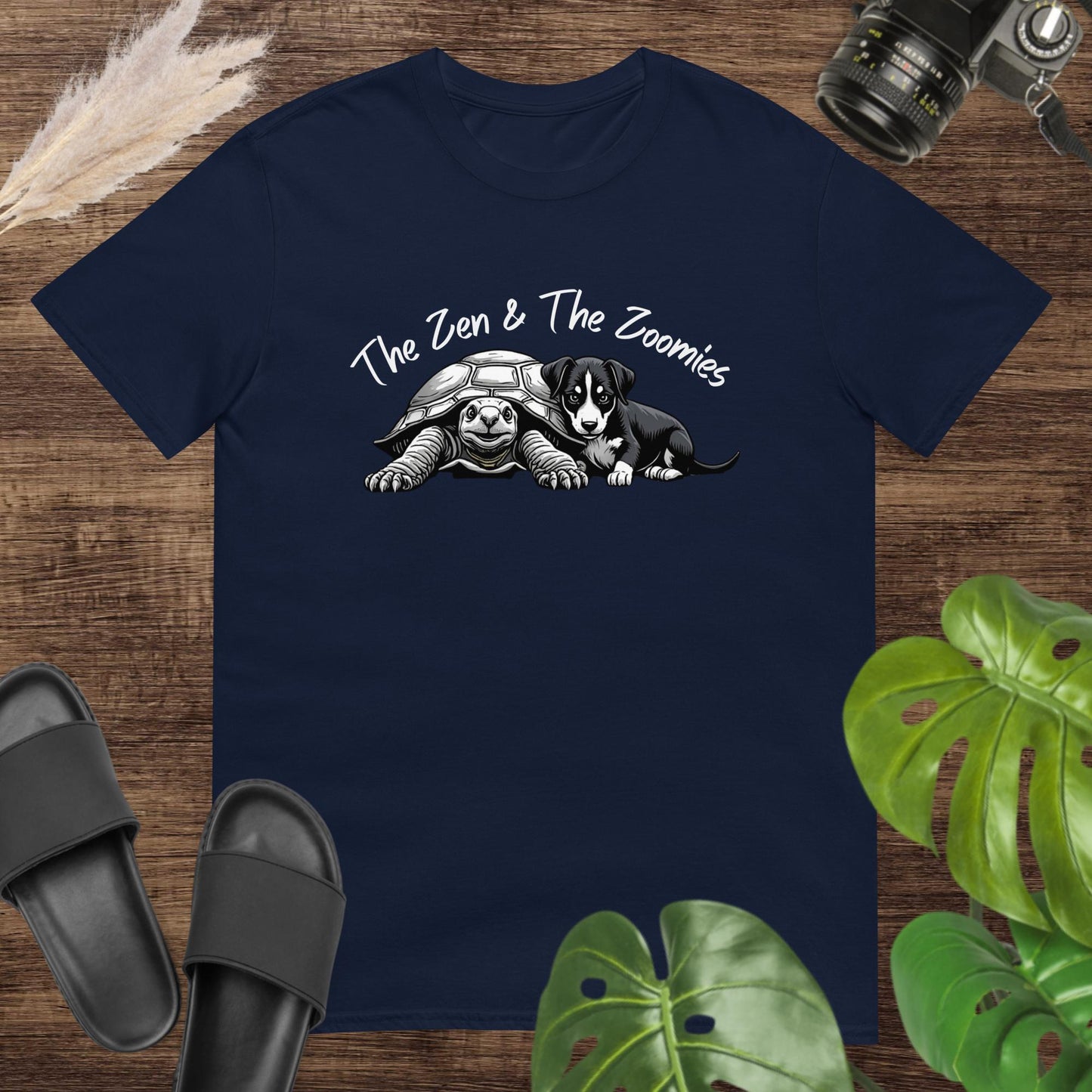 Navy t-shirt featuring a cute black & white turtle and puppy with the text "The Zne & The Zoomies"
