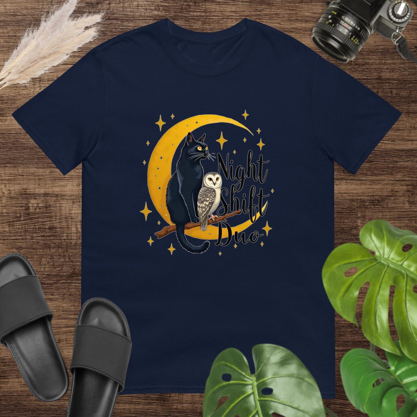 Cute navy t-shirt featuring a cat and owl on a moon and branch with the text "Night Shitf Duo"