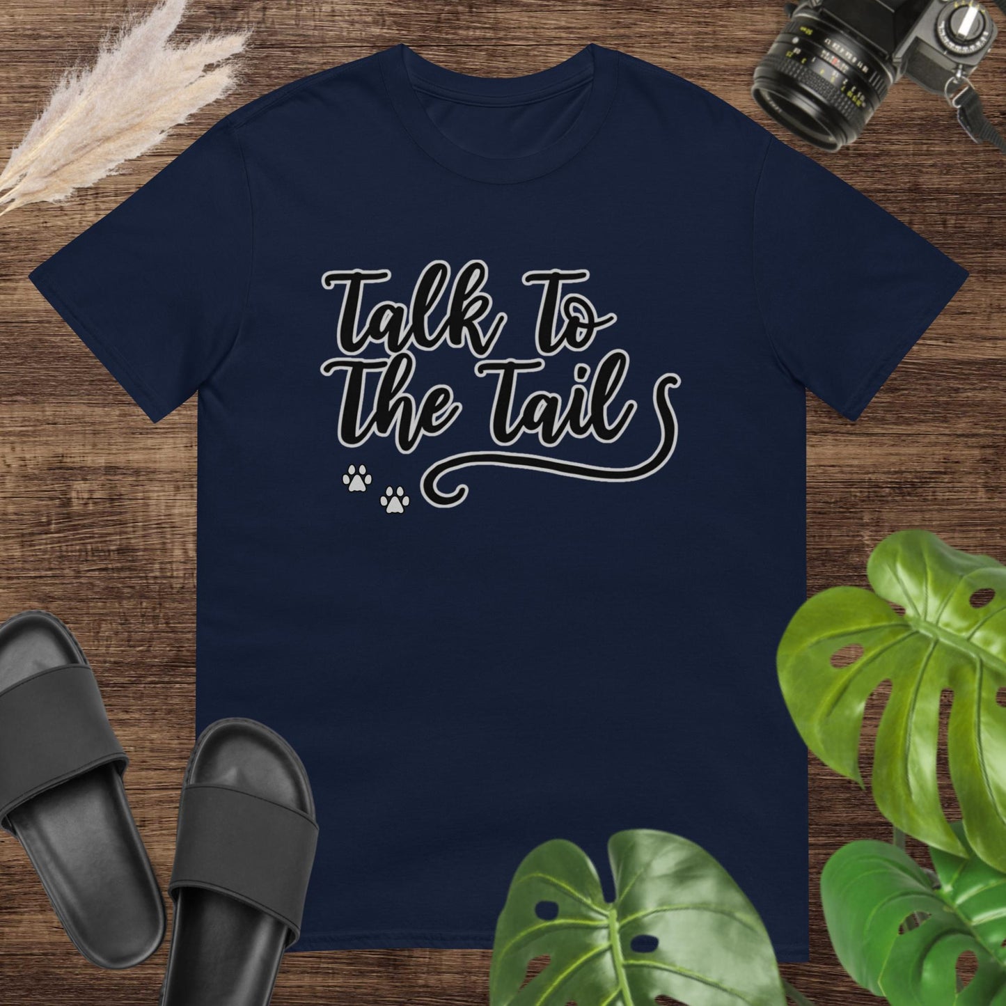 Funny navy t-shirt featuring a tail and 2 little paws after the text Talk to the Tail