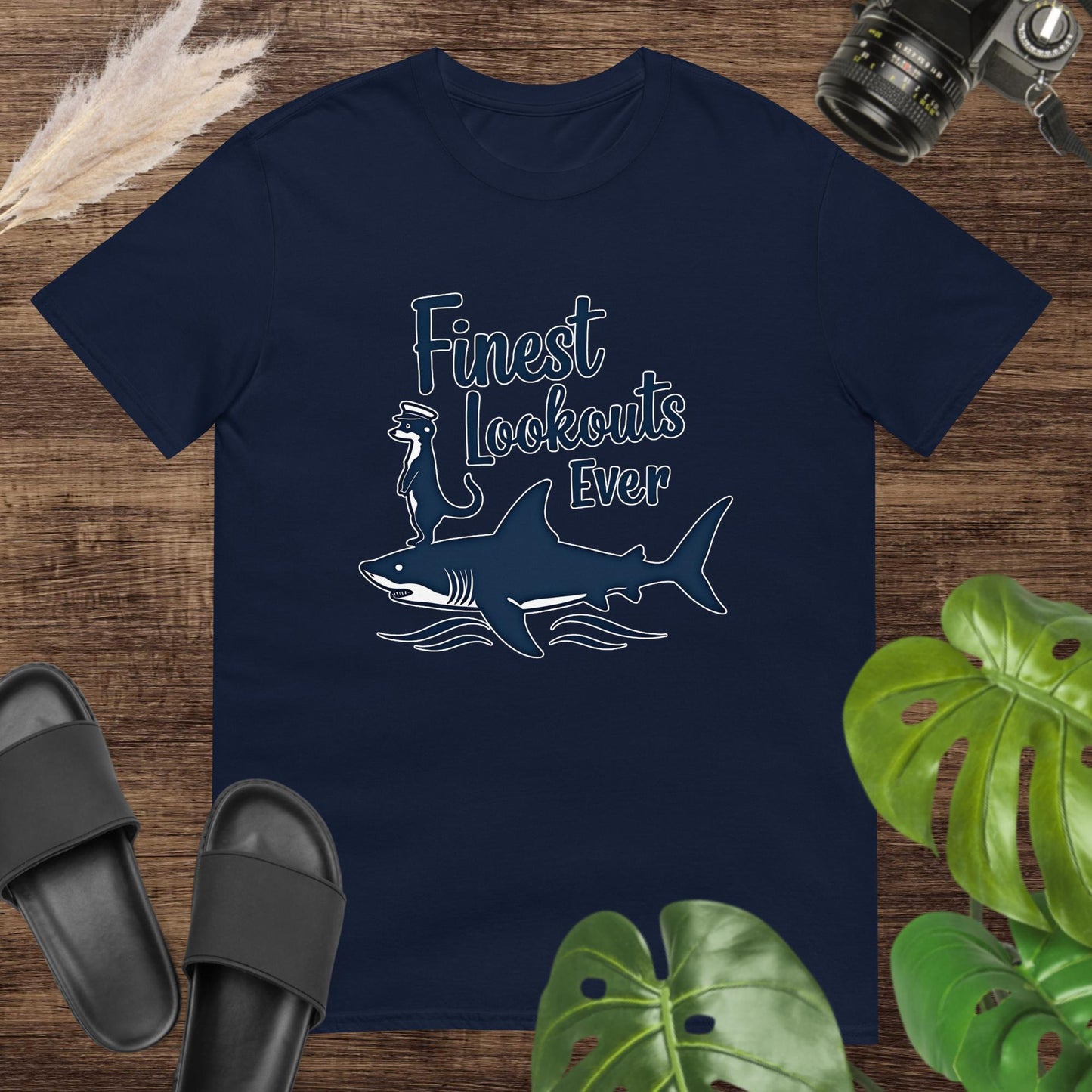 Unisex navy t-shirt featuring a shark with a meerkat and the text Finest Lookouts Ever.
