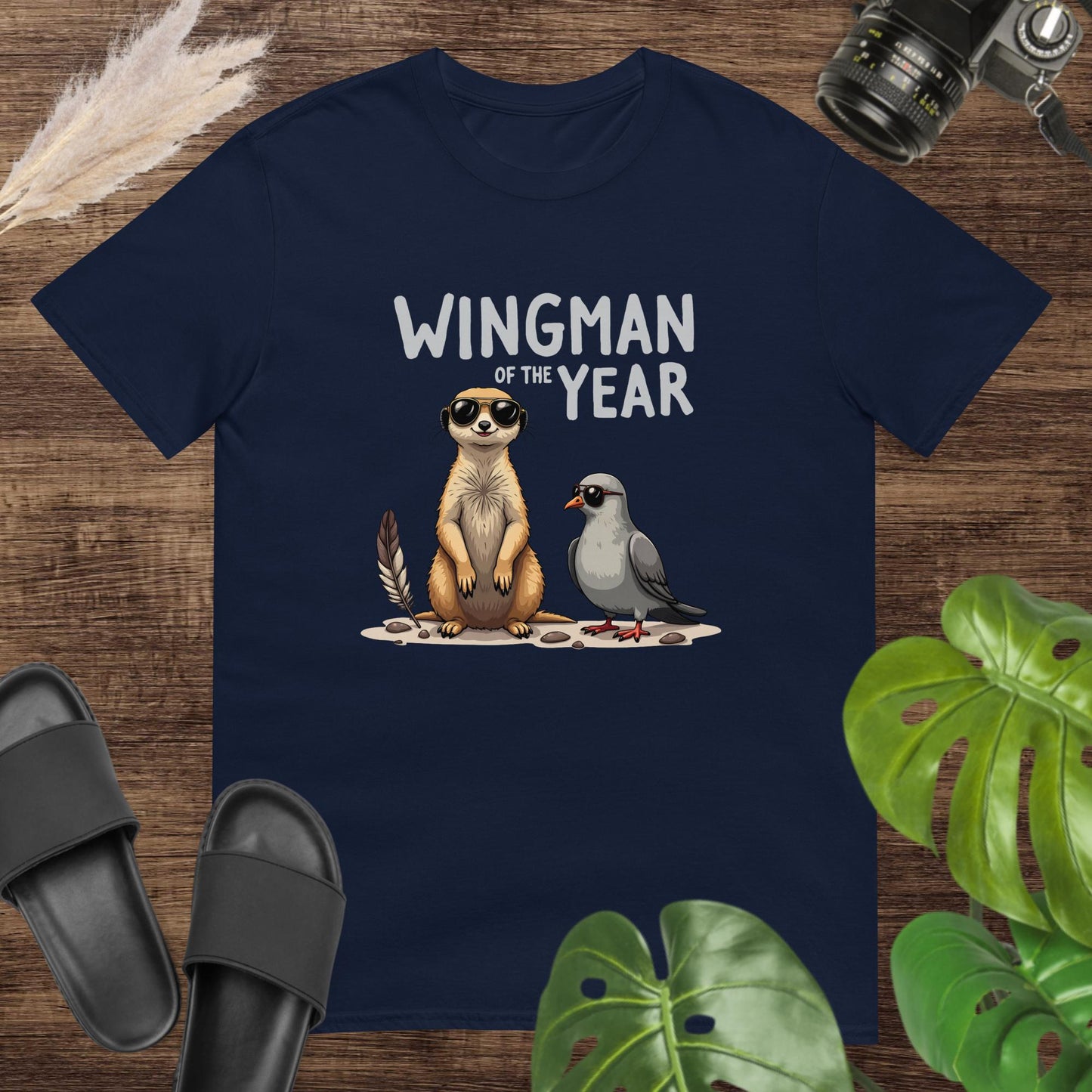Unisex navy t-shirt featuring a meerkat and a pigeon with the text Wingman of the Year.