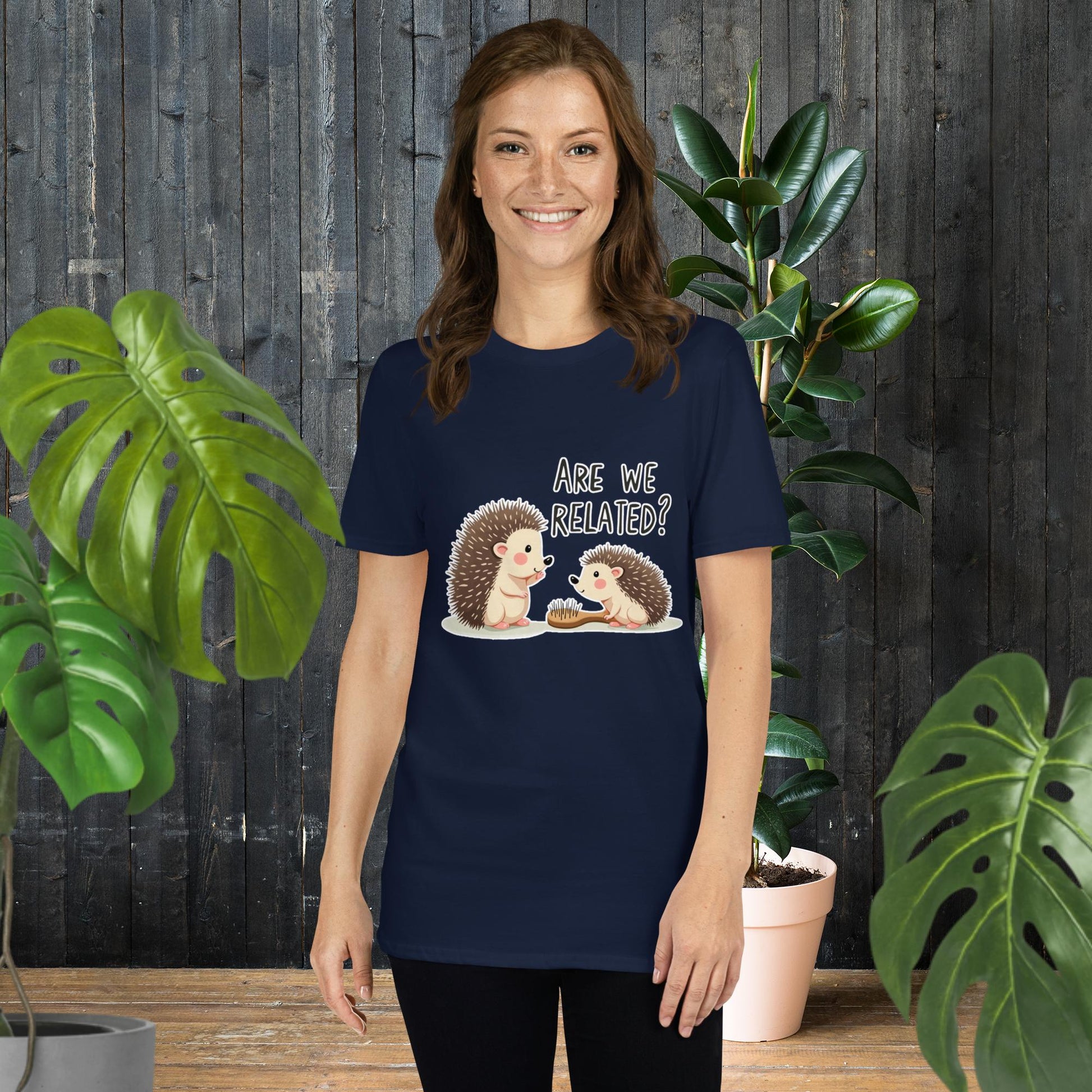 Woman wearing navy tee with cute hedgehog graphic asking 'Are We Related?' — funny animal duo design
