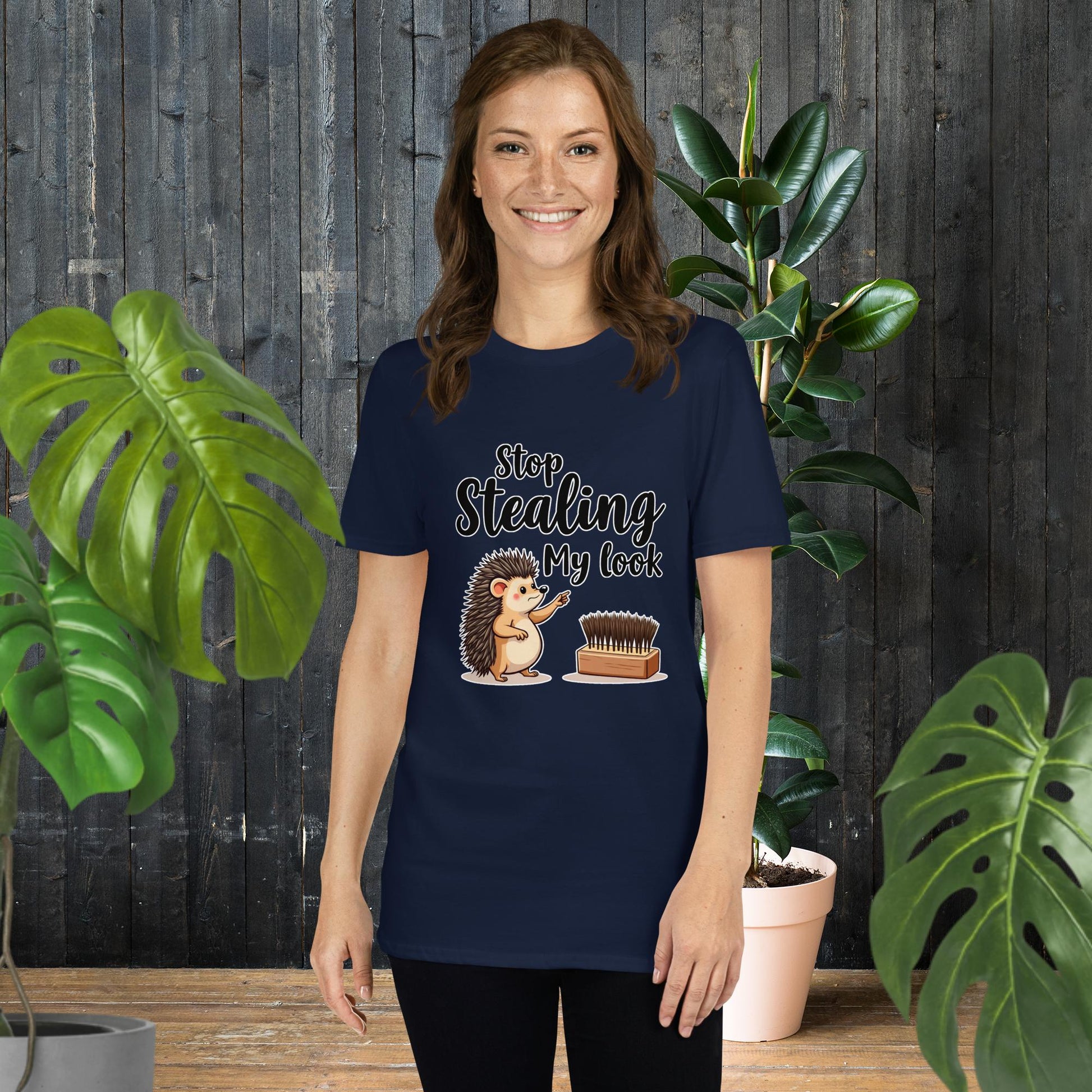 Woman wearing navy t-shirt with cute hedgehog graphic saying 'Stop Stealing My Look' — funny animal tee for pet lovers