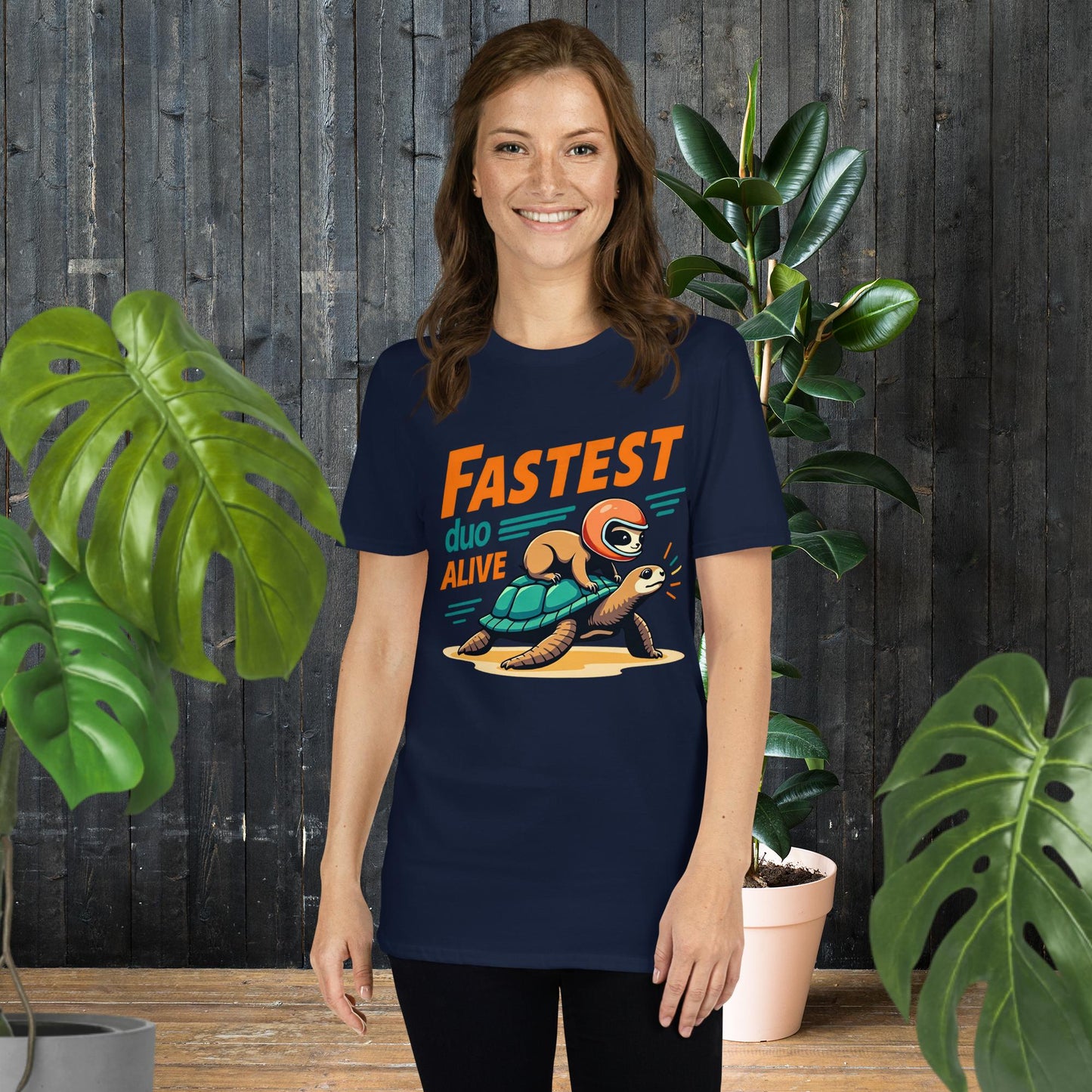 Funny unisex tee with sloth riding turtle, 'Fastest Duo Alive' graphic, perfect for pet lovers