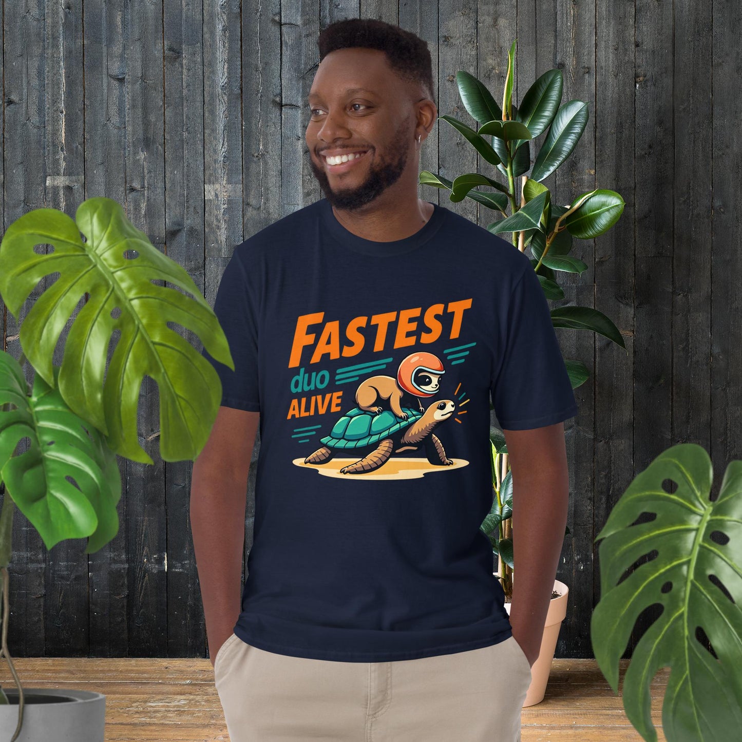 Funny unisex tee with sloth riding turtle graphic, 'Fastest Duo Alive' text, perfect for pet lovers
