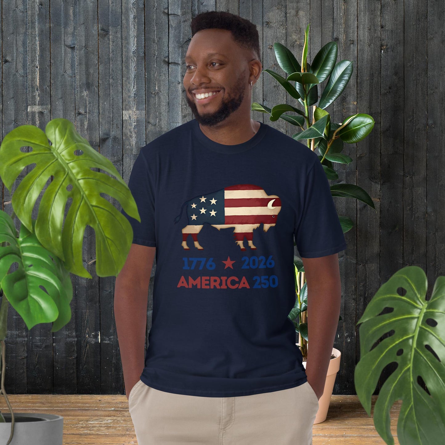 Man wearing navy t-shirt with American flag bison graphic, '1776 2026 America 250' text, unisex patriotic tee