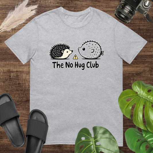 Unisex t-shirt featuring a hedgehog and pufferfish with a no-hug club slogan.
