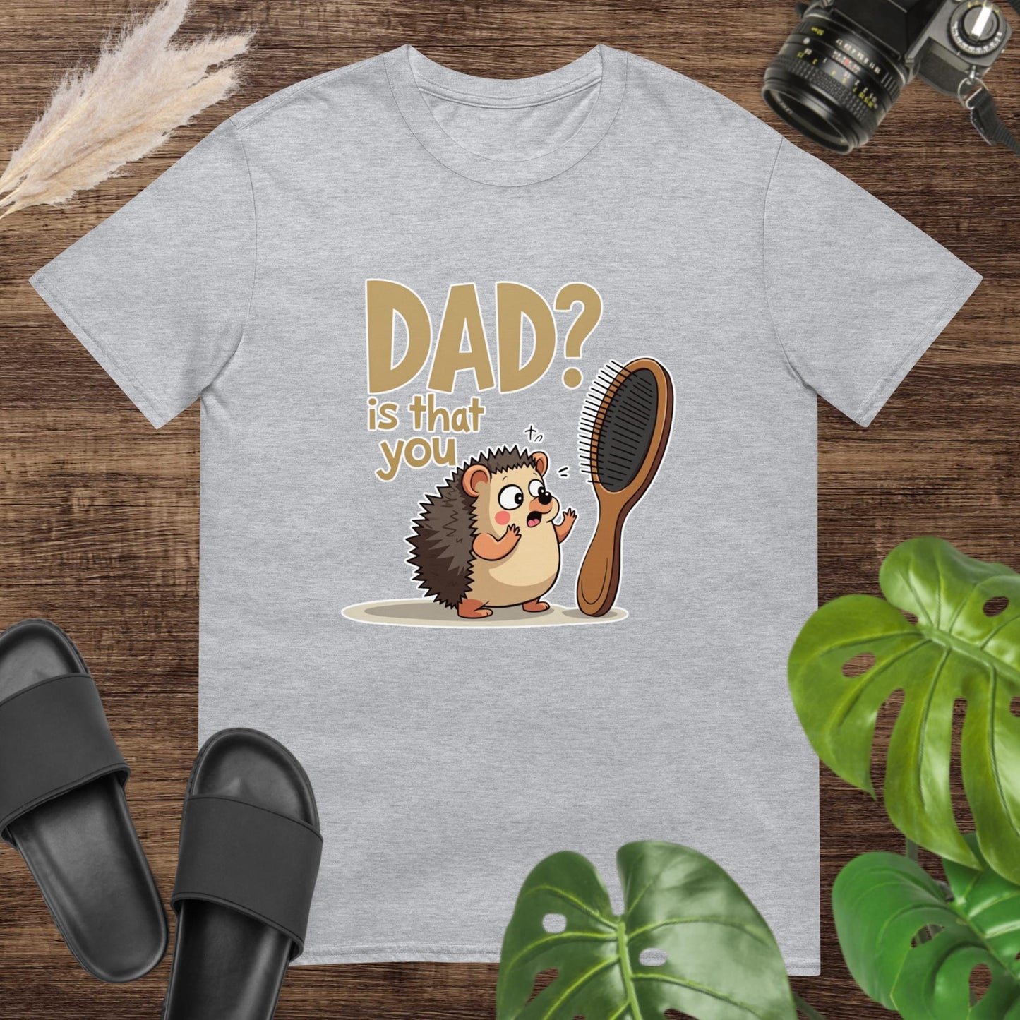 Cute grey t-shirt featuring a cartoon hedgehog beside a hairbrush and text "Dad? is that you"