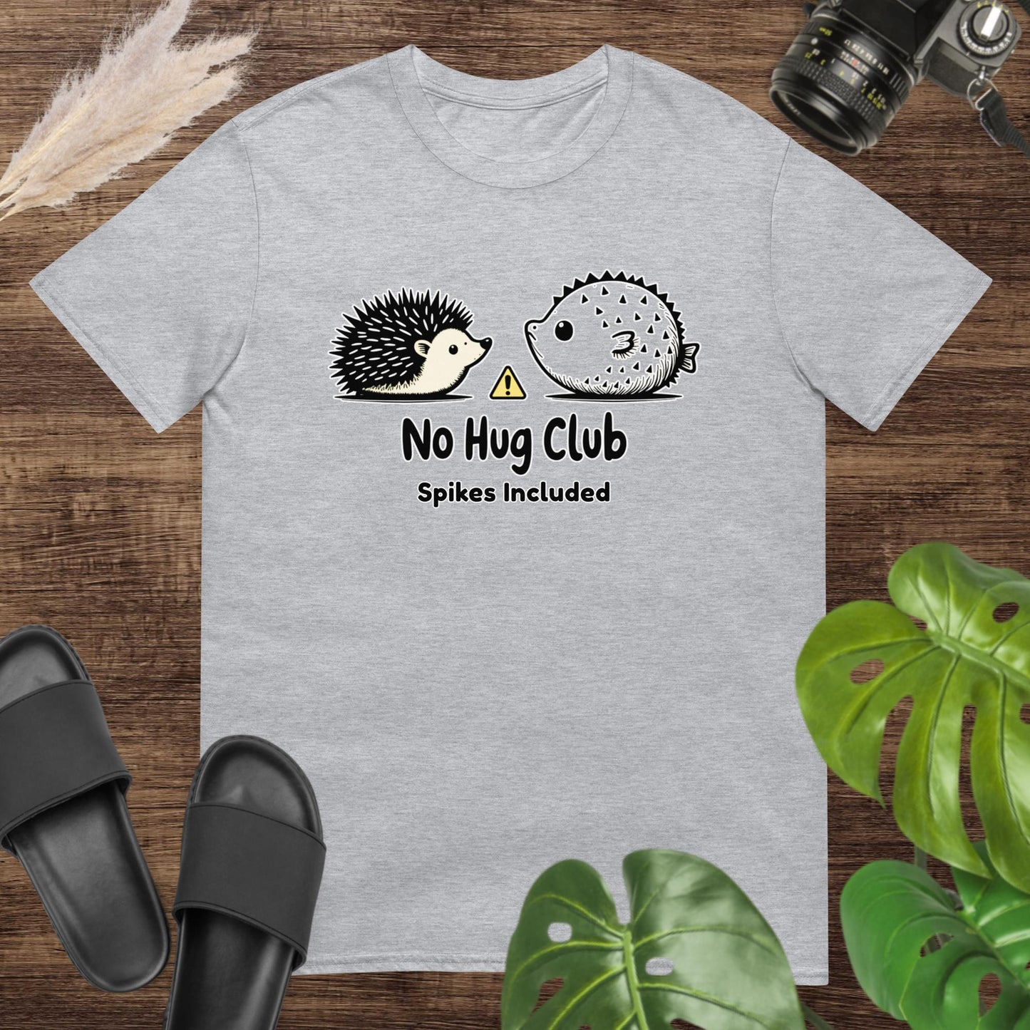Unisex grey t-shirt featuring a hedgehog and pufferfish shirt with a no-hug message.