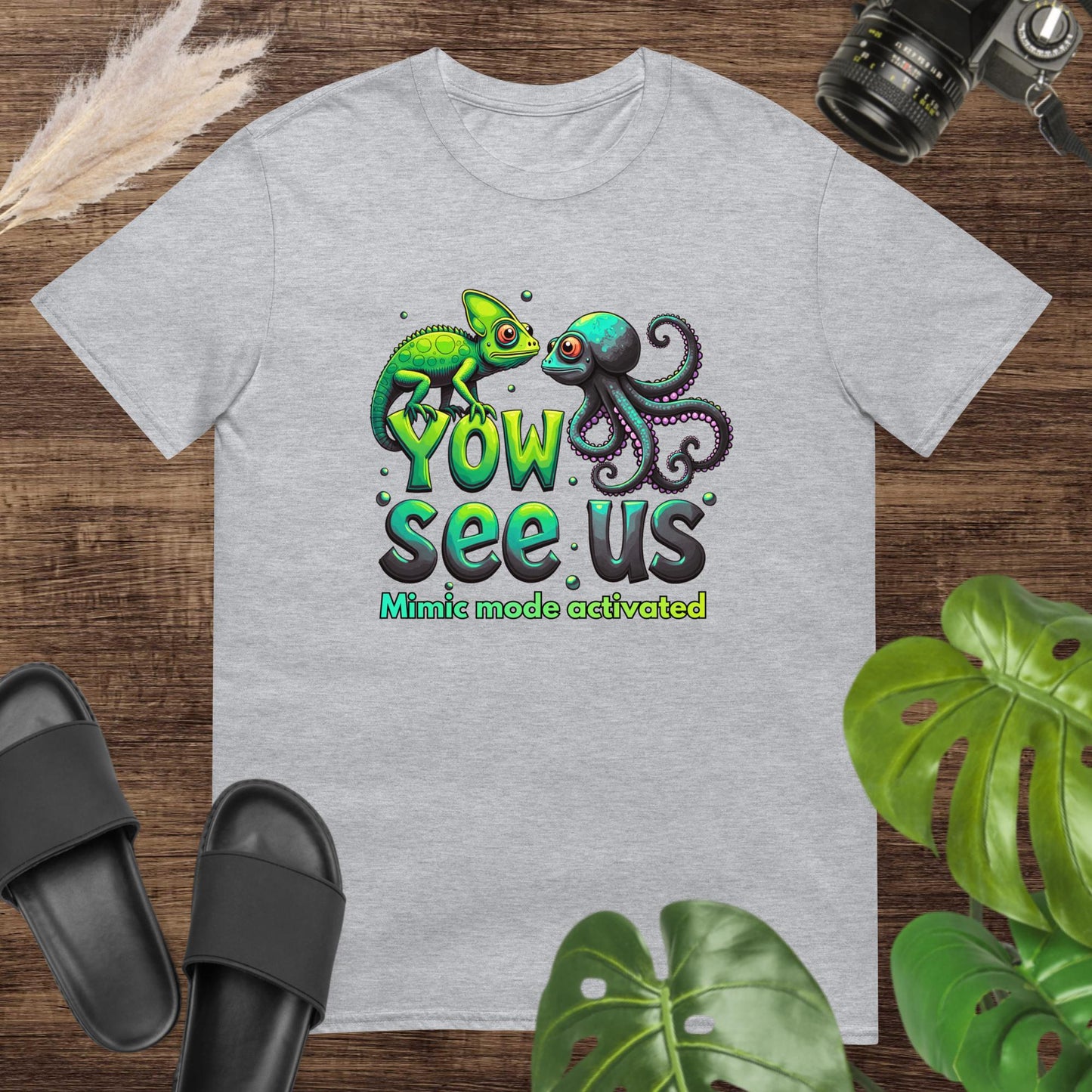 Grey t-shirt featurung a chameleon and an octopus shirt with the text "Yow see us. Mimic mode activated"