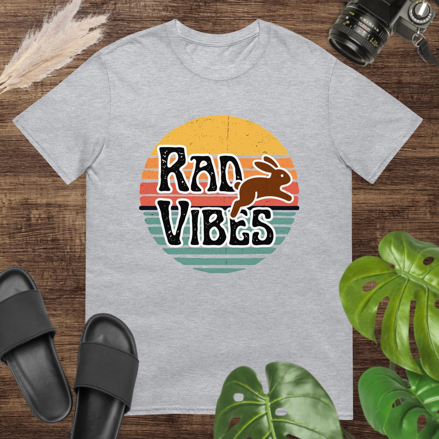 Grey vintage sunset style t-shirt with a running rabbit ant the text Rad Vibes