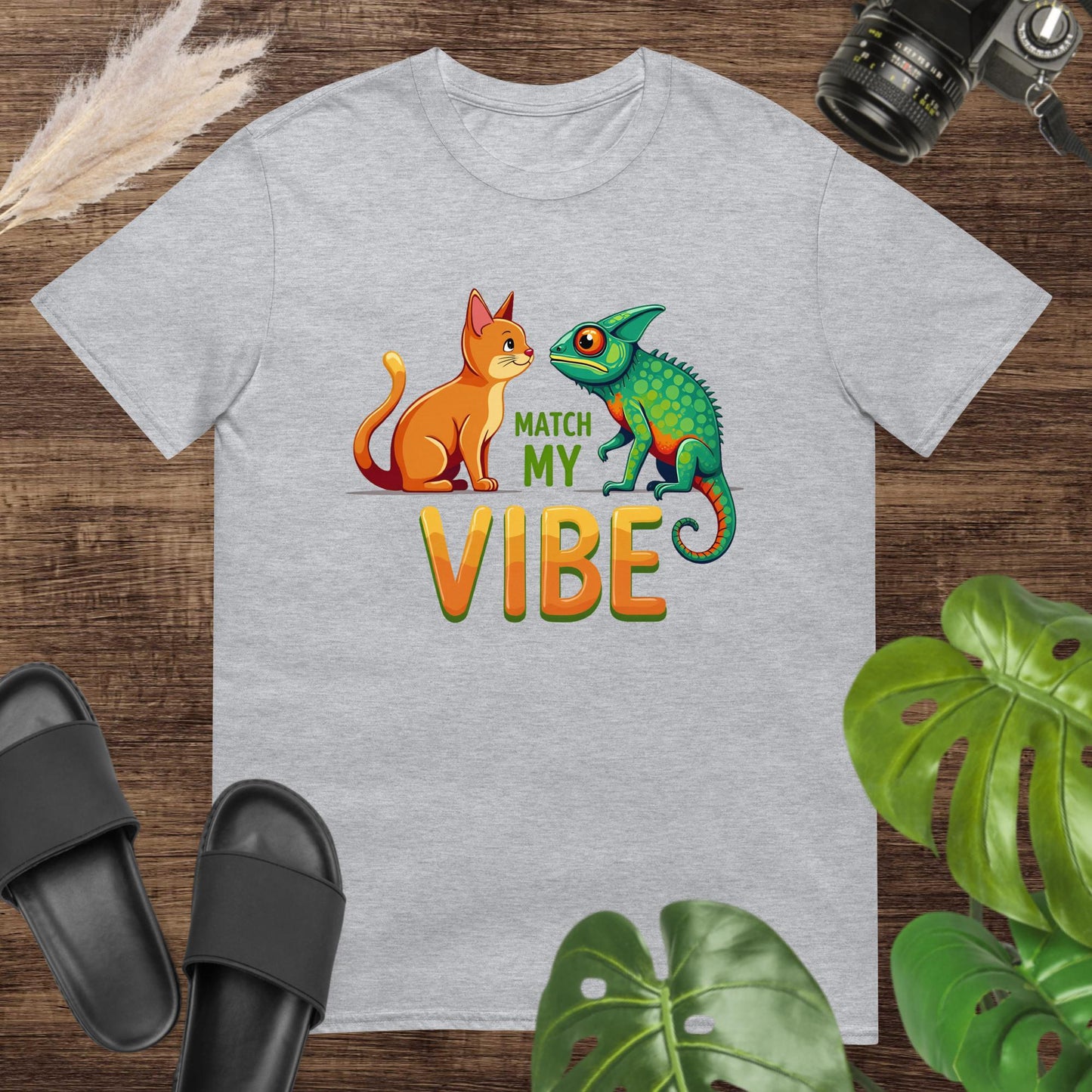 Unisex grey t-shirt featuring a cat and chameleon with the text Match My Vibe.