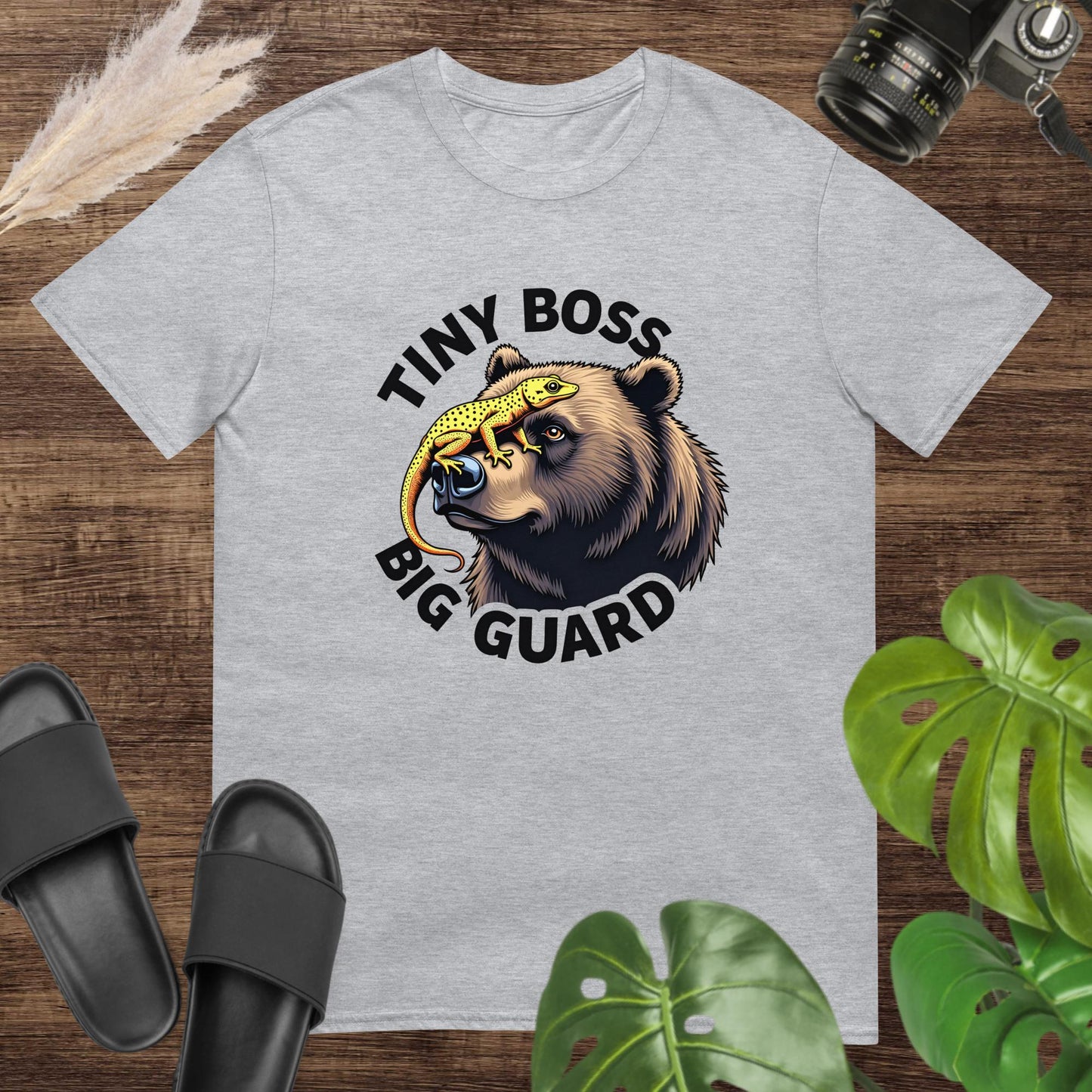 Unisex grey tee featuring a bear and gecko graphic with Tiny Boss, Big Guard text.