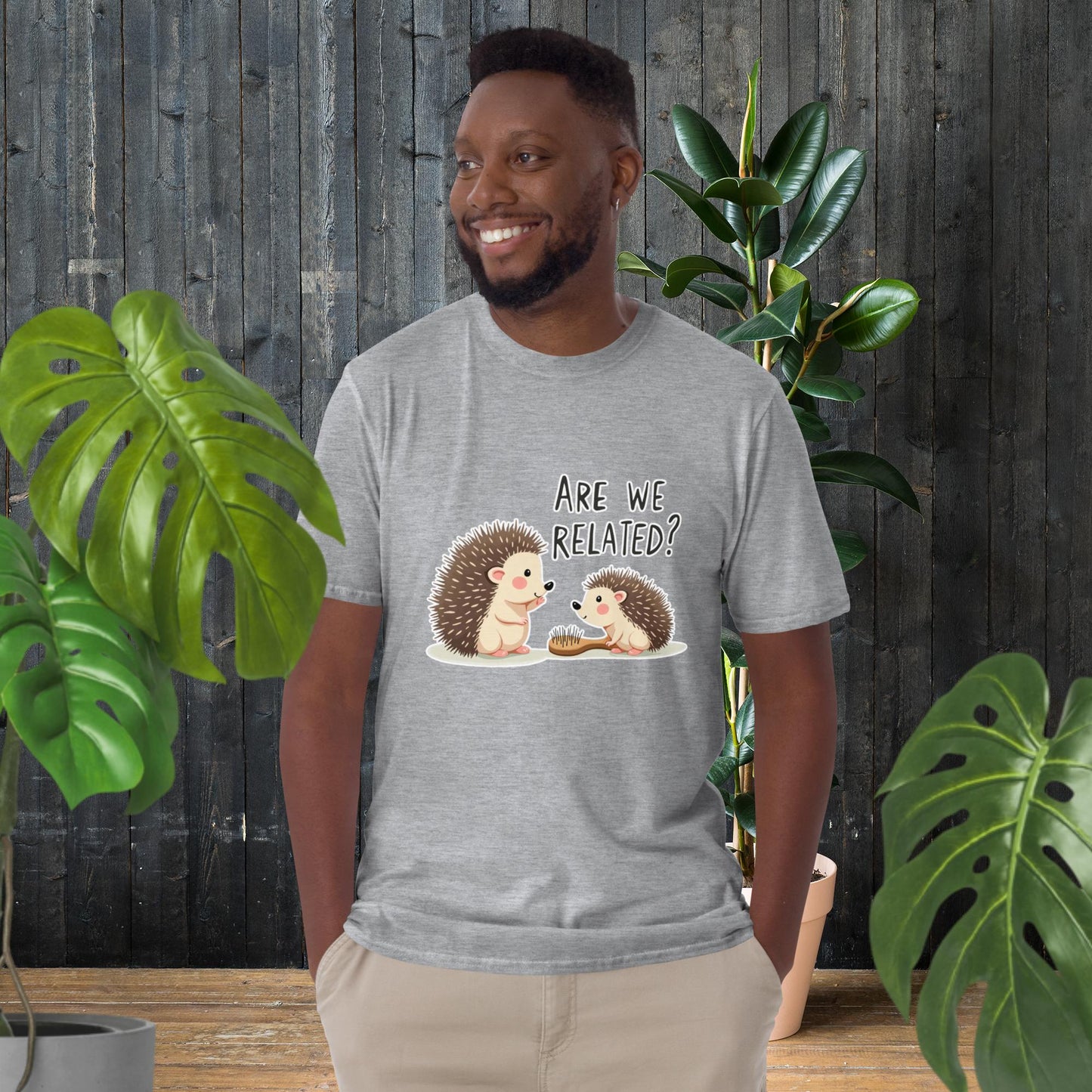 Man wearing funny hedgehog graphic tee with 'Are We Related?' text, cute animal duo design, unisex cotton t-shirt