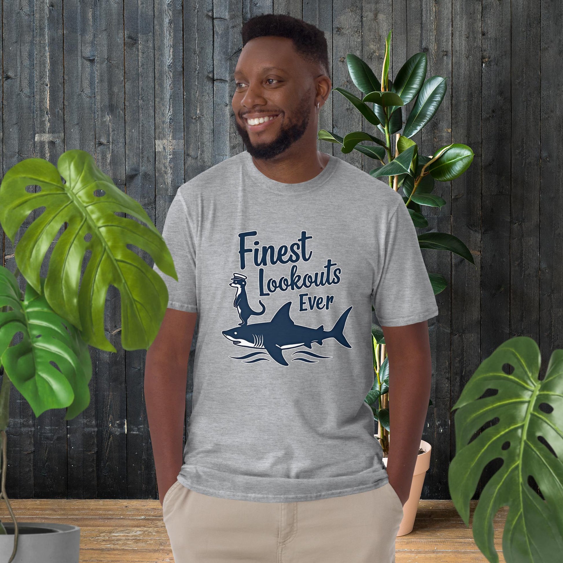 Man wearing funny shark and otter graphic tee, 100% ring-spun cotton, unisex fit, perfect gift for pet lovers